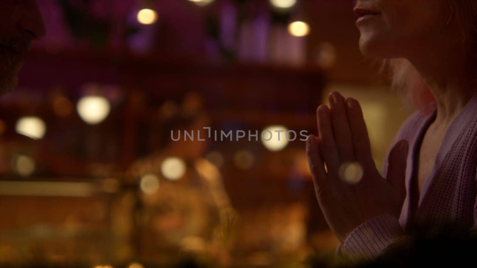 Beautiful woman communicating and gesticulating at the restaurant. Stock footage. Concept of social life. by Mediawhalestock