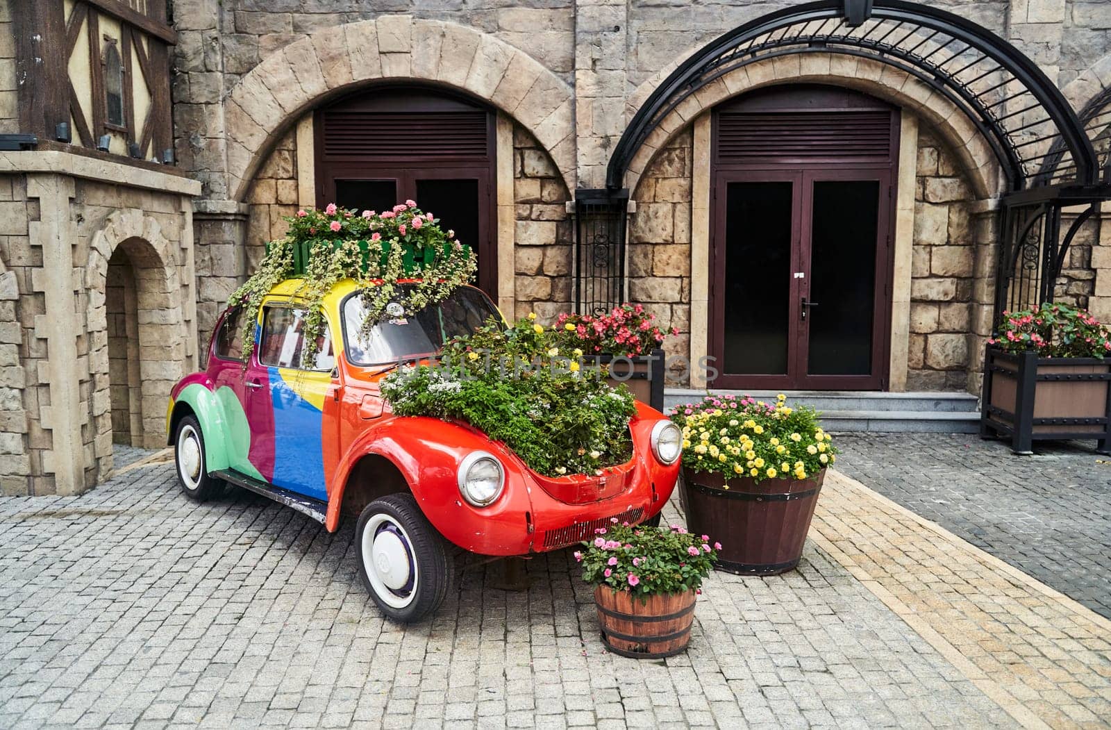 Vintage car decorated with flowers in the photo zone in a romantic style by driver-s