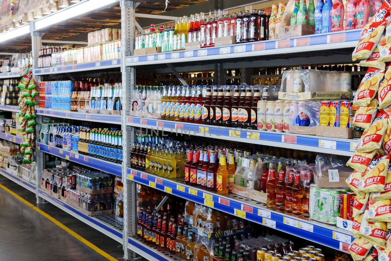 Tyumen, Russia-December 11, 2023: Shop windows with alcohol, beer. Beer in bottles and tin cans.