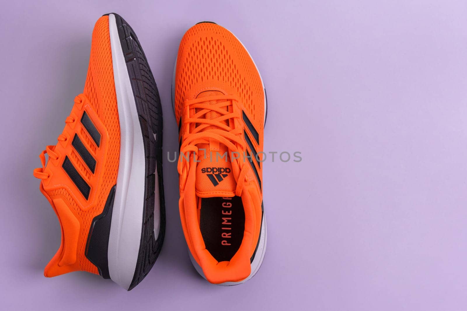 Tyumen, Russia-November 25, 2023: New Adidas orange color sneakers. Selective focus by darksoul72