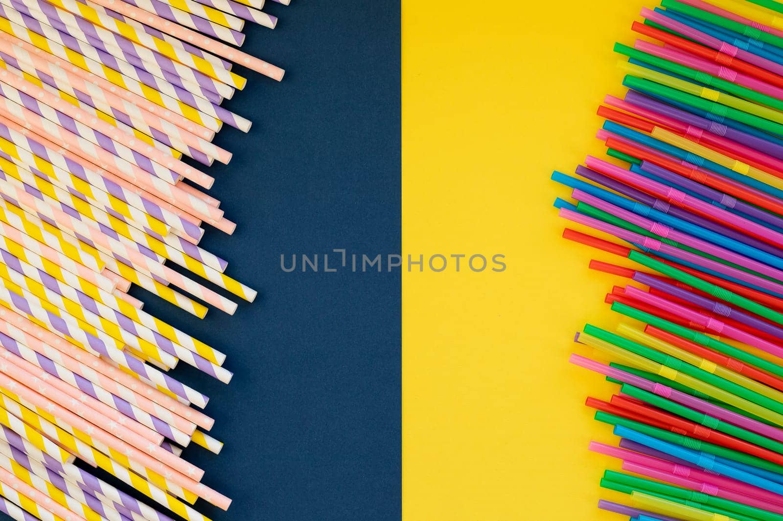 Paper straws vs plastic straws on colorful background.colored tubules for juice and cocktails. Event and party supplies.Colorful design and abstract. by YuliaYaspe1979