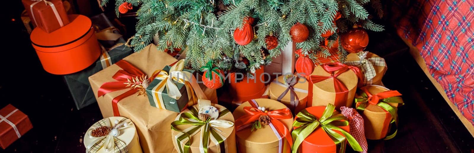 Christmas background with many gift boxes decorated with ribbon on floor under Christmas tree. Winter holidays concept. stack of Boxes with gifts under the Christmas tree by YuliaYaspe1979