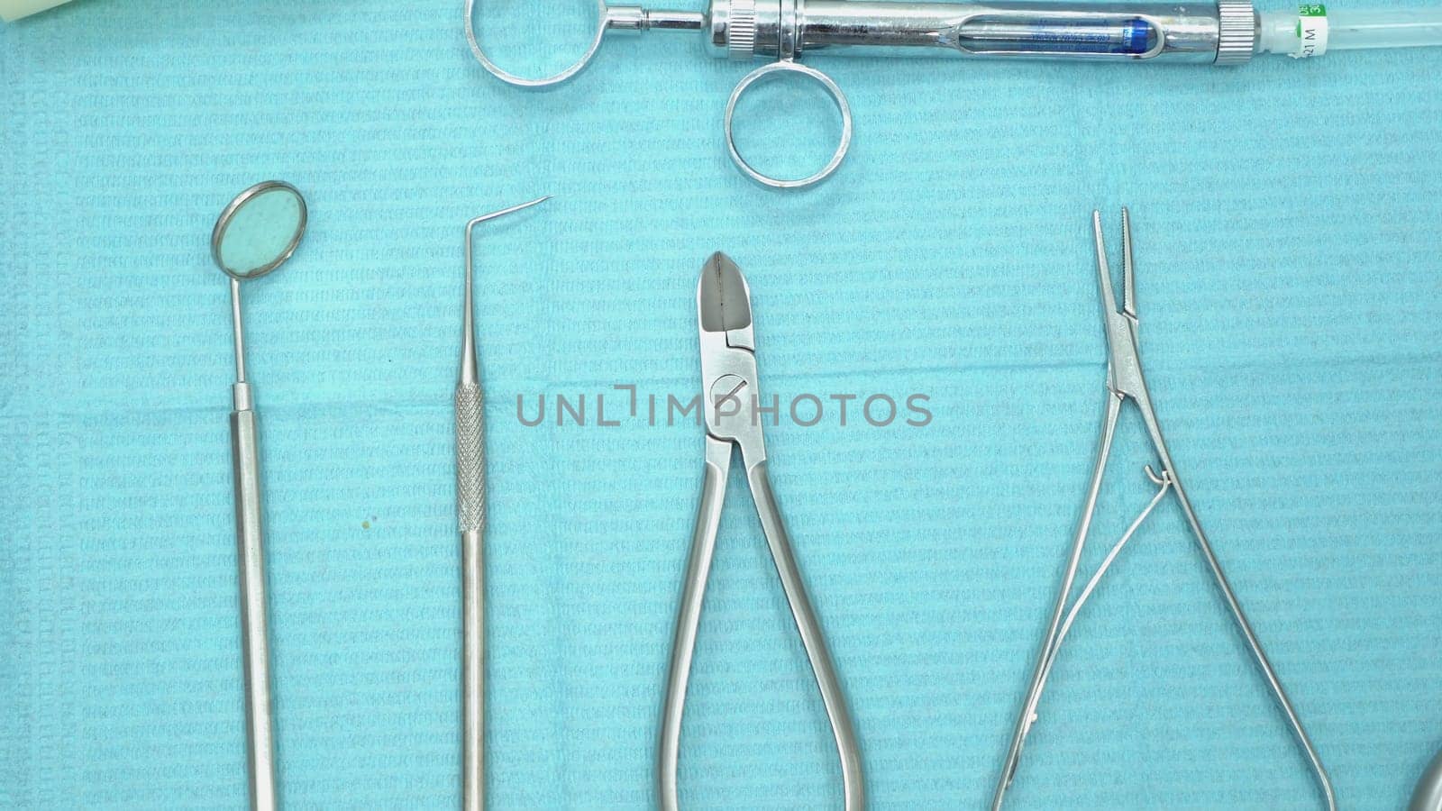 Close-up of professional dental instruments. Media. Metal various sterile tools in dental office ready for application in work.