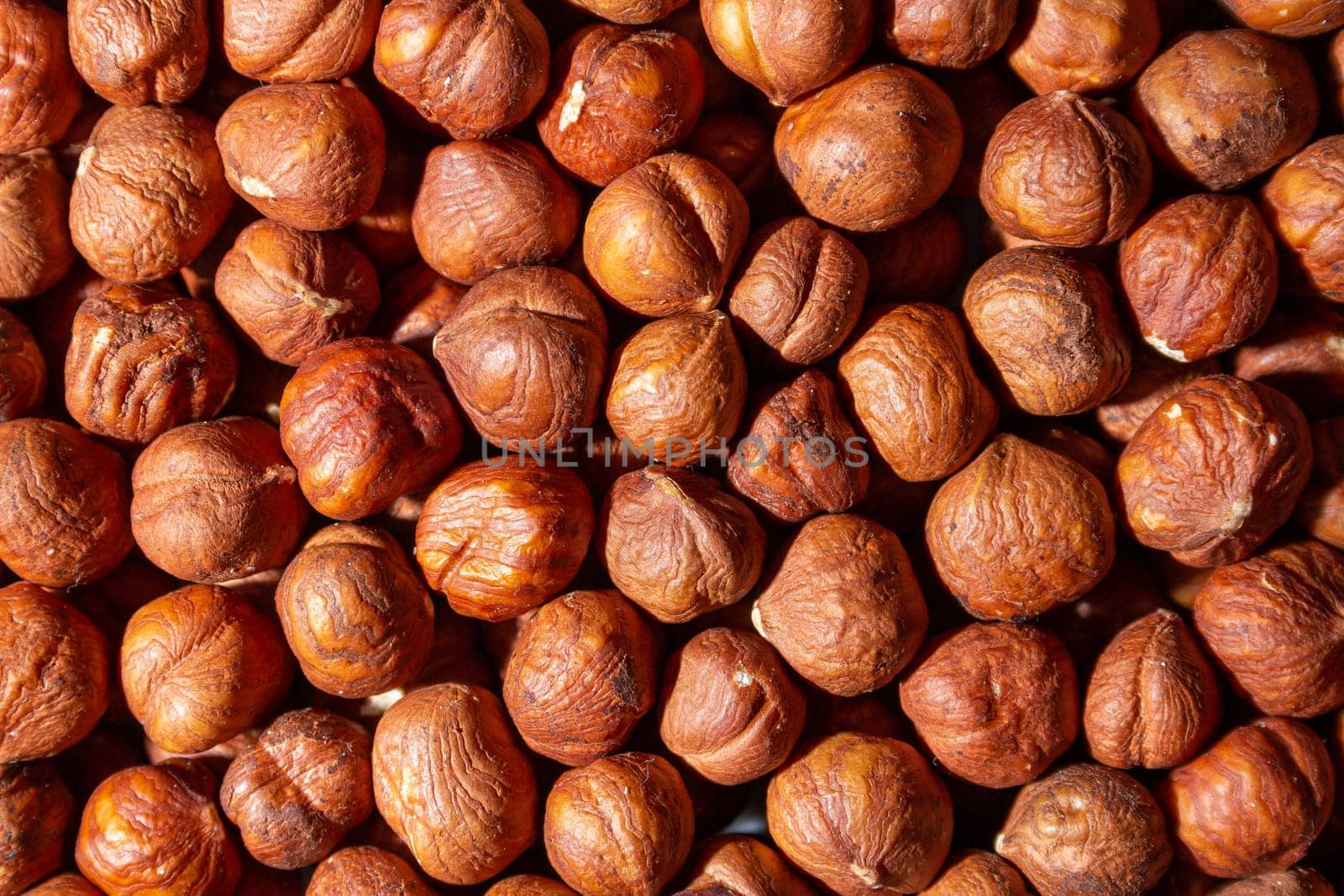 Scattered Peeled Hazelnut - Top View. Background from Hazelnuts. Natural High-Calorie Snacks