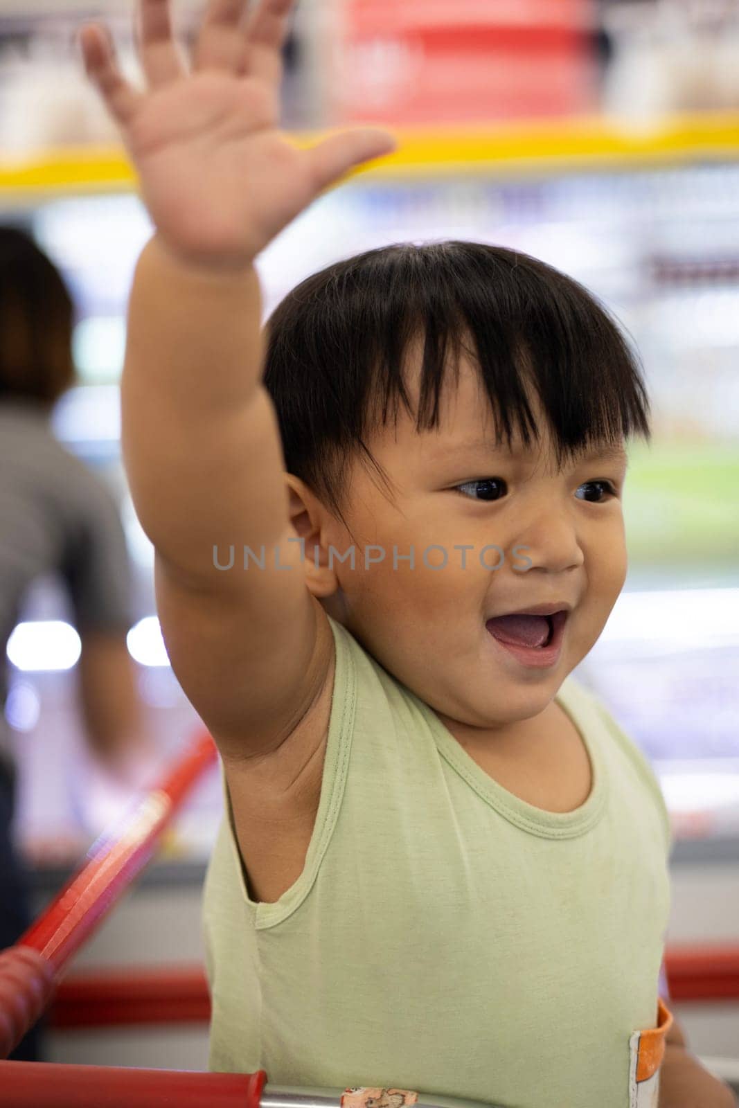 A boy shows a negative gesture with his hand forward with a sad face. Close up