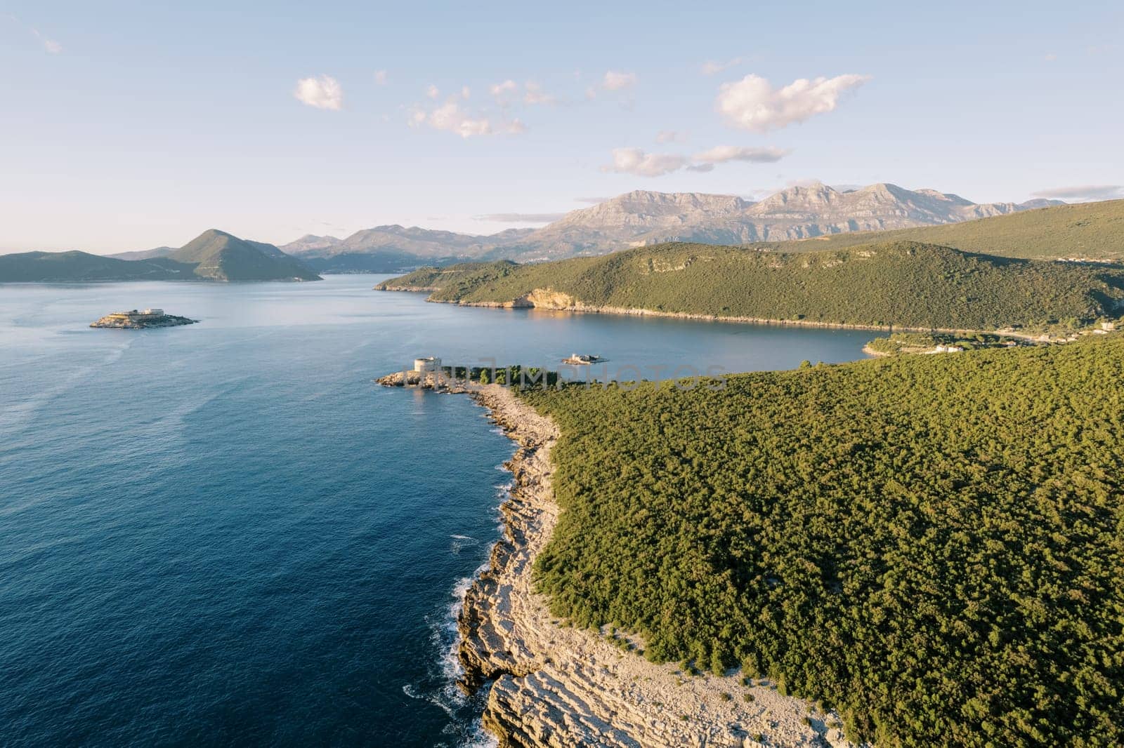 Lustica peninsula against the backdrop of mountains and the Arza fortress. Montenegro. High quality photo