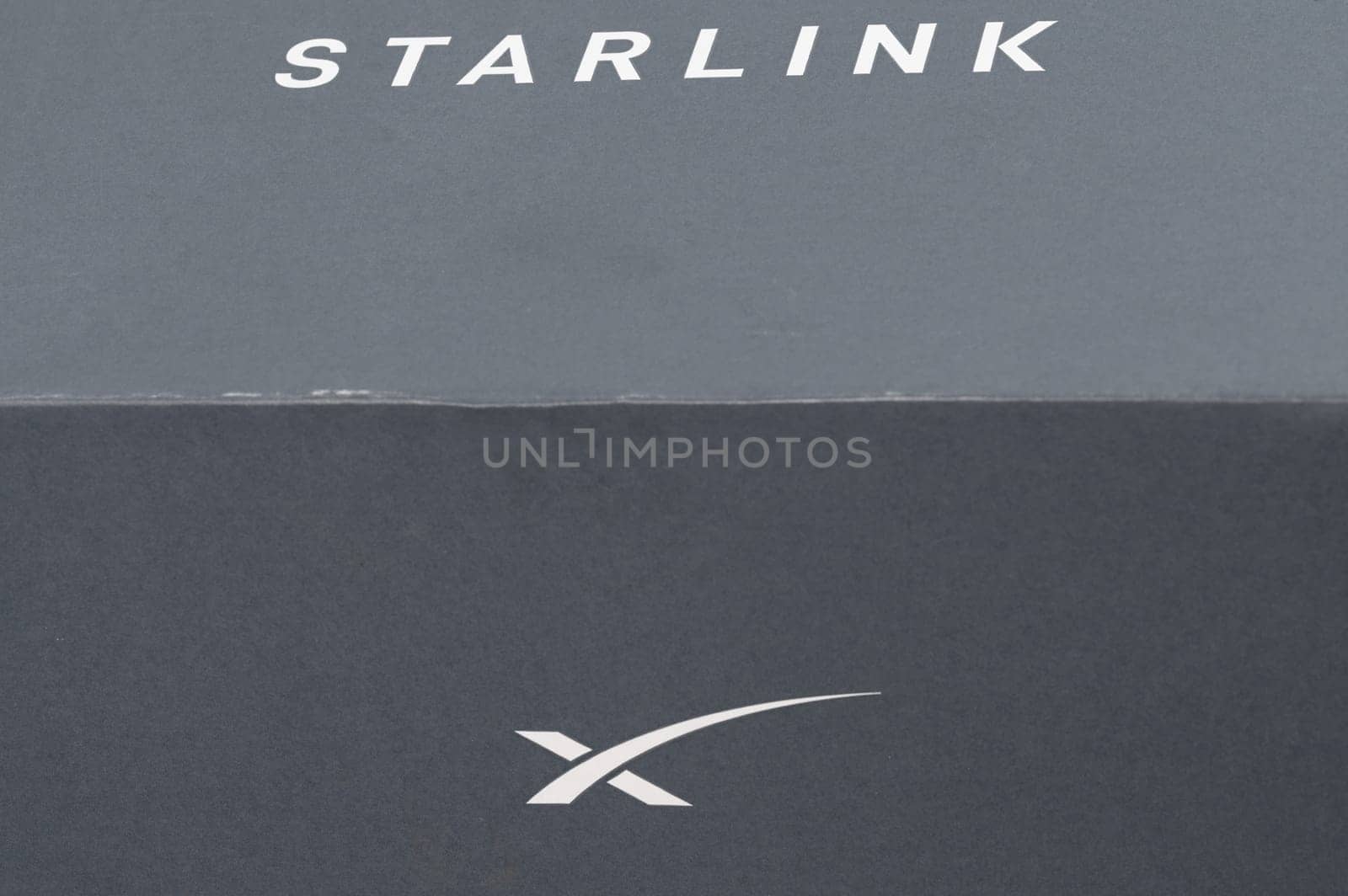 Ivano-Frankivsk, Ukraine December 2, 2023: Starlink antenna box with logo, Elon Musk space company.