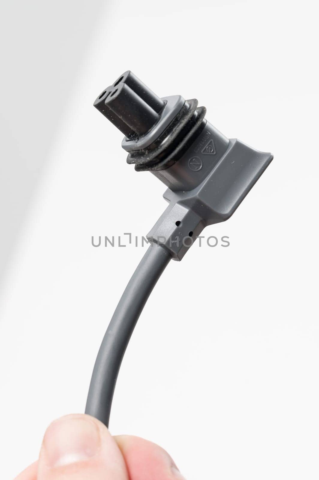 Ivano-Frankivsk, Ukraine December 2, 2023: adapter cable for Starlink satellite antenna on a white background.