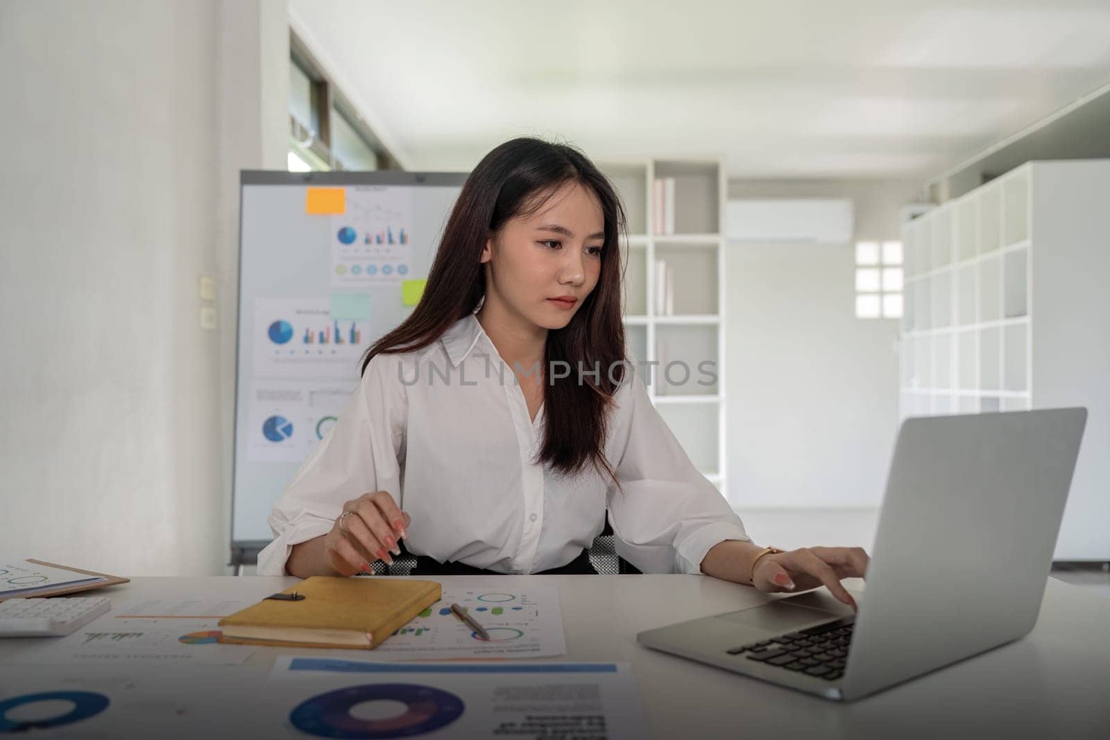 Business woman doing finance on desk in office and business working, tax, accounting, statistics and analytic research concept.