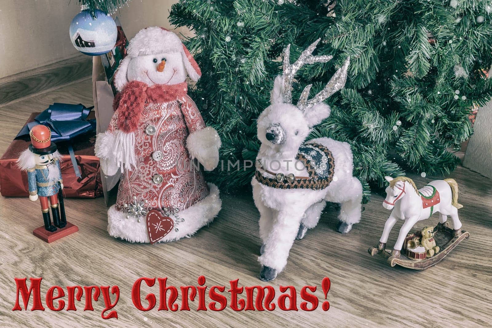 A variety of gifts for children for Christmas are prepared under the green Christmas tree