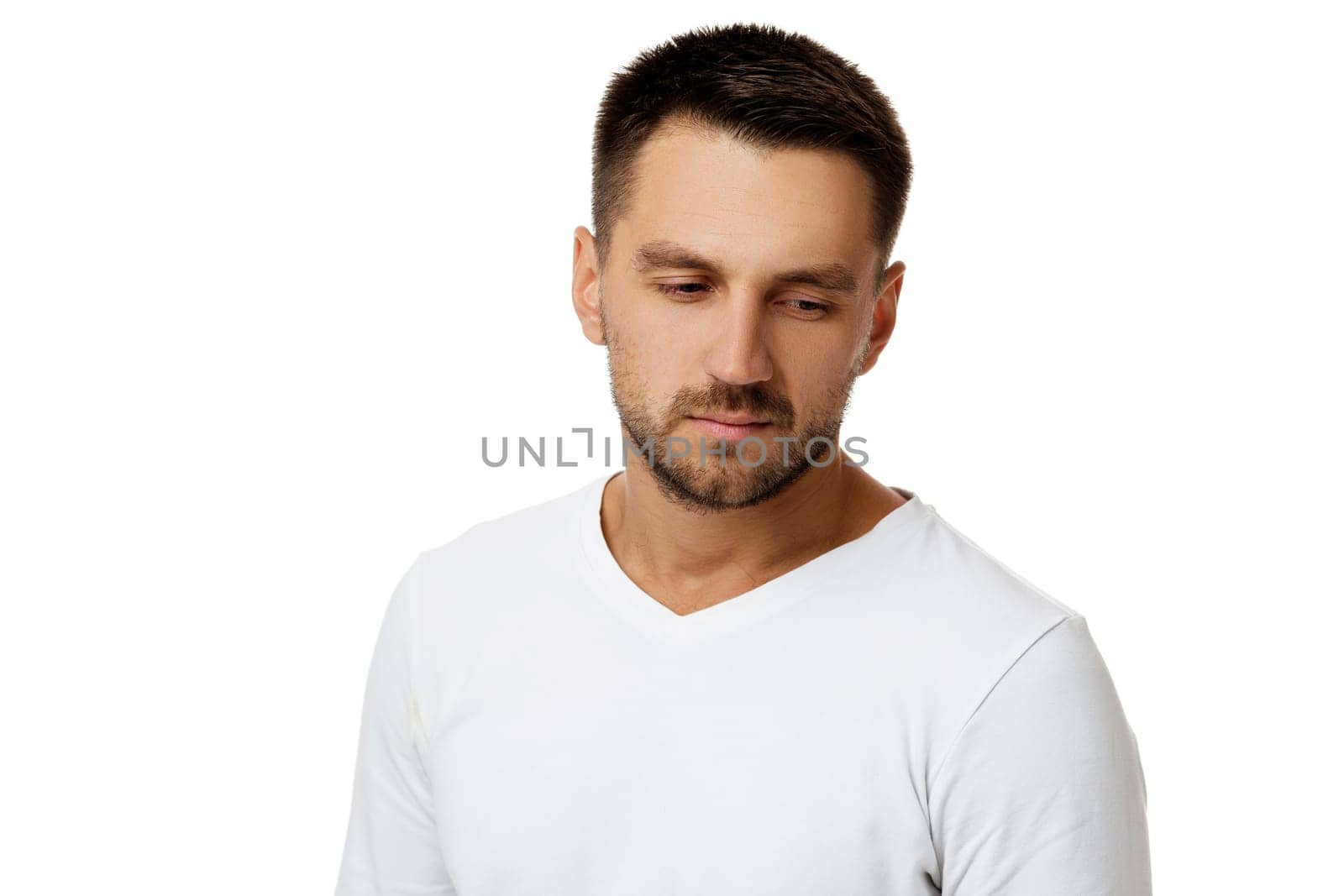 portrait of sad bearded man in casual white shirt by erstudio