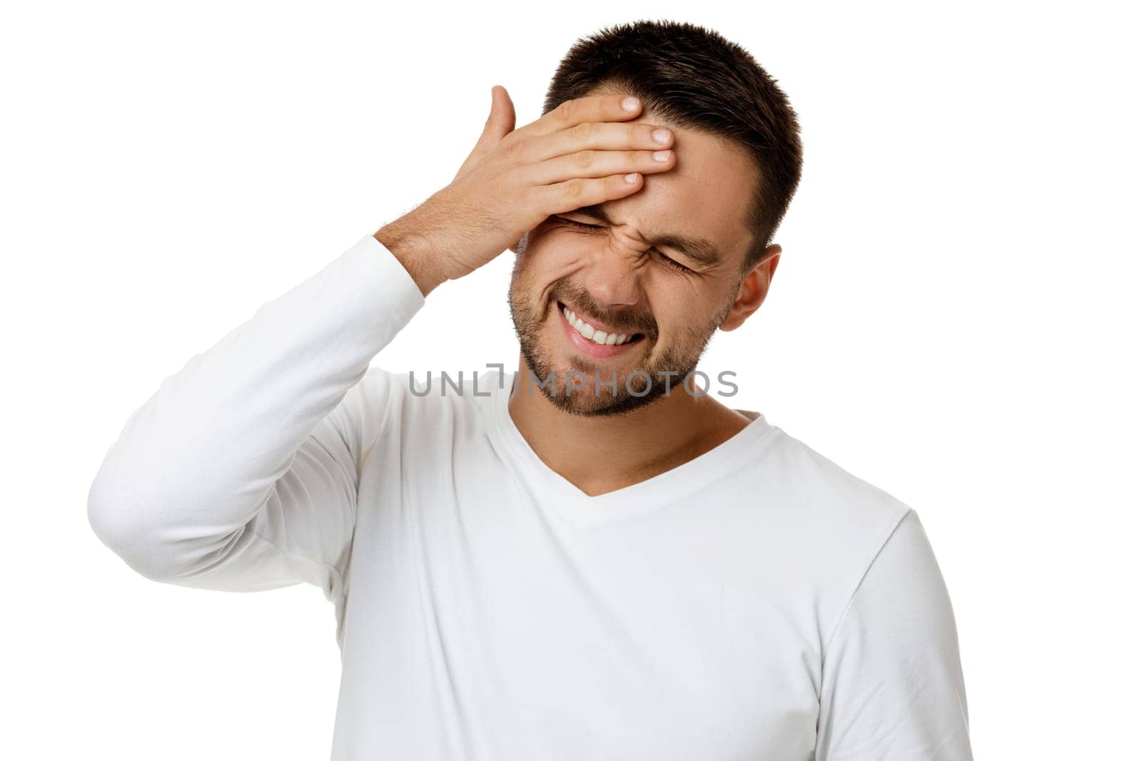 upset bearded man in casual white shirt keeps hand on head by erstudio