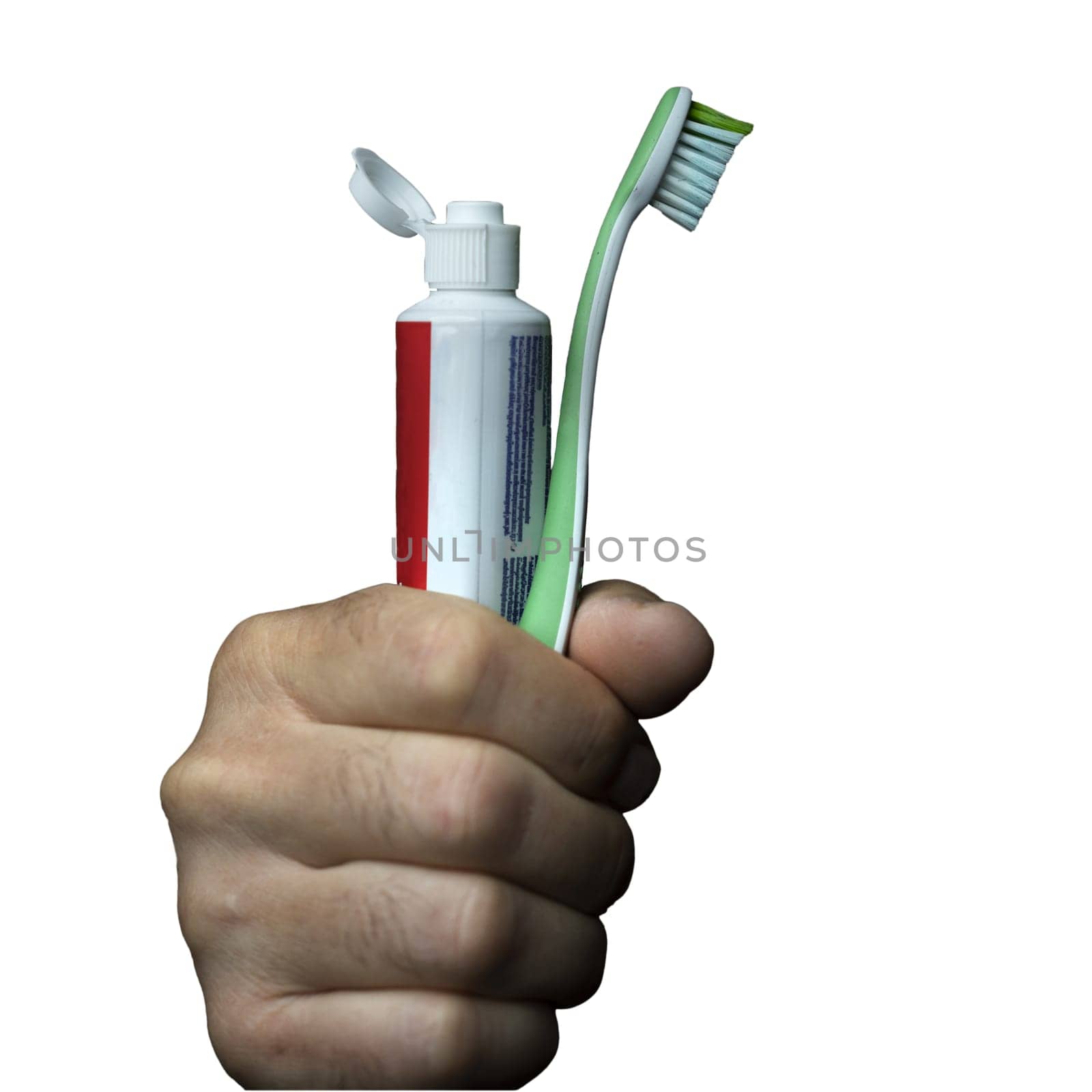a man with a toothbrush and a tube of toothpaste in his hand