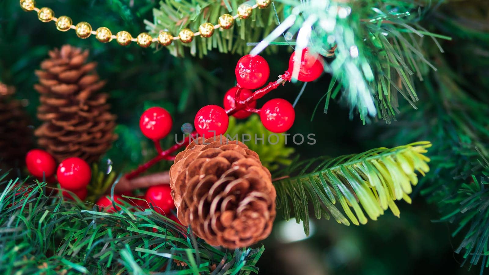 artificial christmas tree decoration. close up, shallow depth of field. defocused background