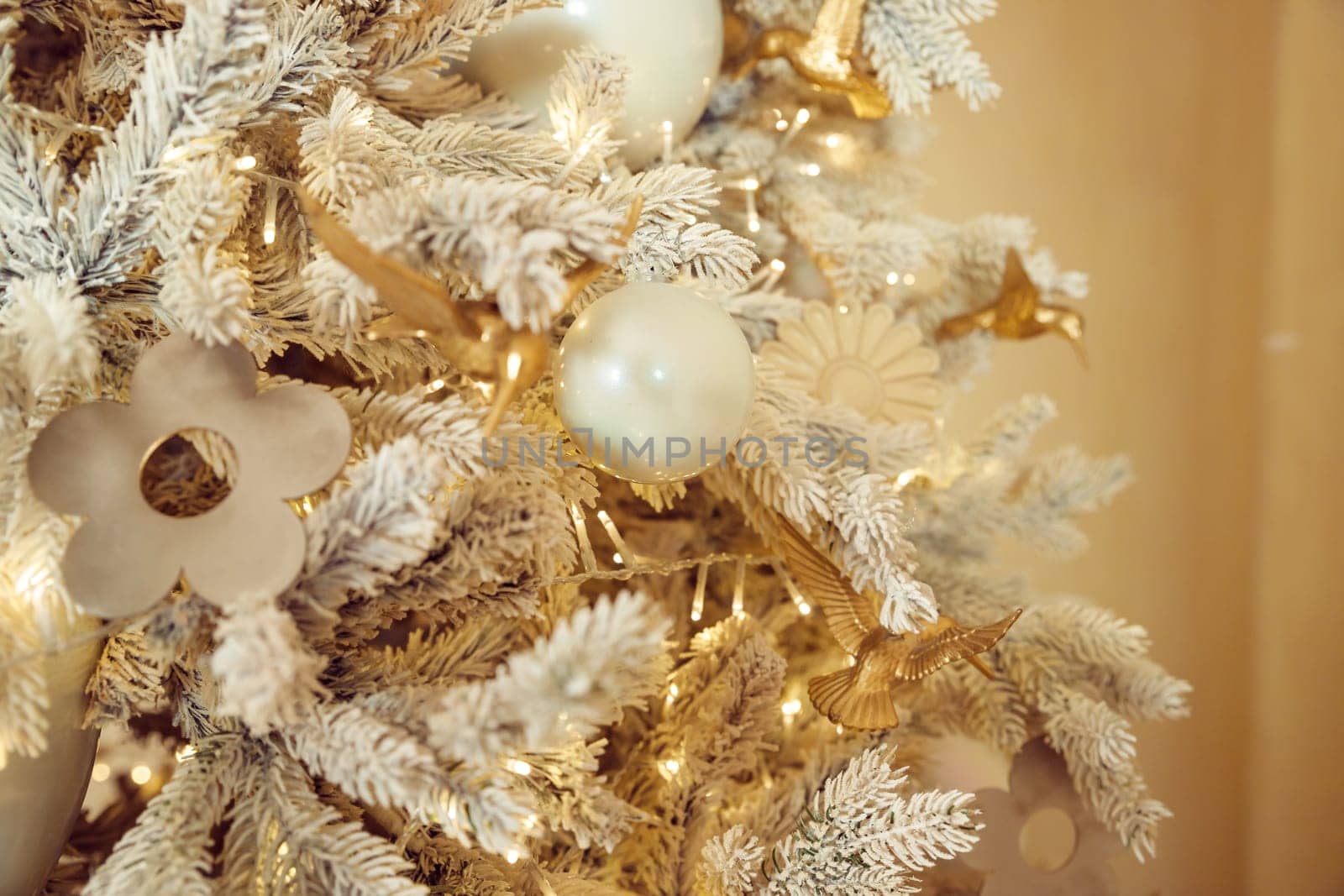 Close up Luxury gold and silver ball, baubles decoration hanging on the white pine christmas tree, with black background very contrast or dekorasi natal
