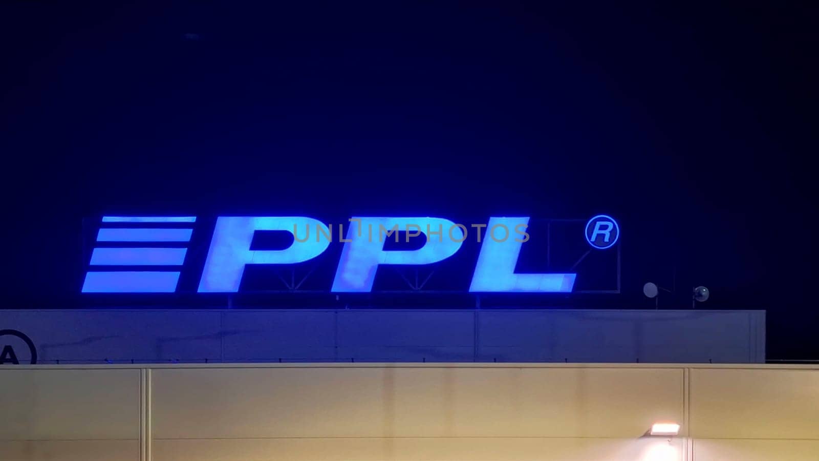 HUSTOPECE, CZECH REPUBLIC - DECEMBER 14, 2023: PPL logo on the depot building. PPL CZ specializes in parcel transport not only in the Czech Republic, but also throughout Europe. It employs over 1000 staff and 2,000 drivers who deliver tens of millions of shipments every year.