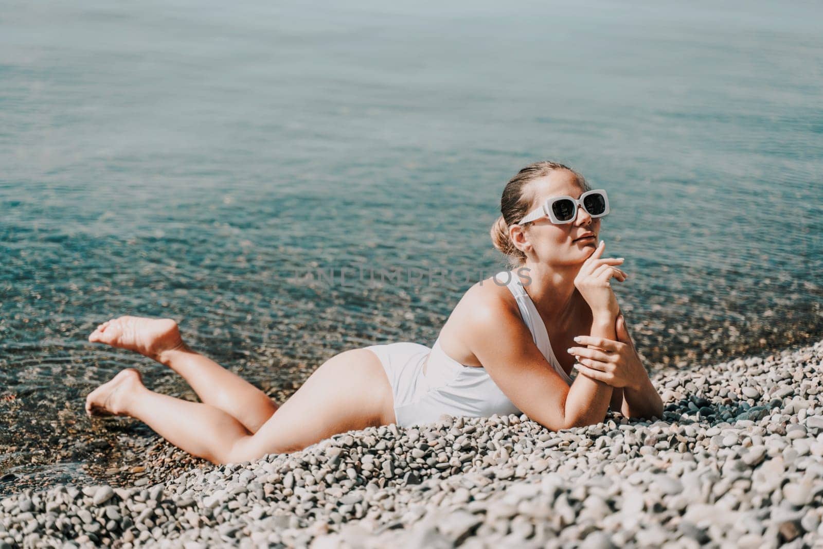 Woman white bikini beach tan. Happy woman in swimwear on vacation. Summer travel holidays vacation on the sea.