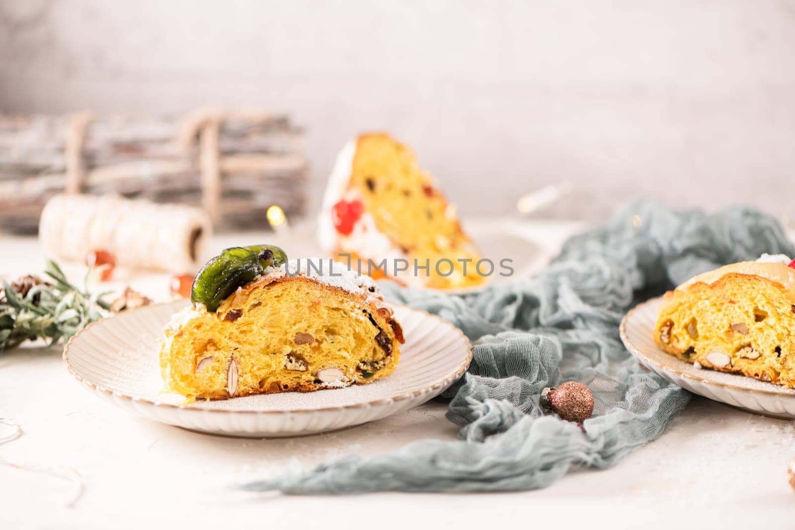 Bolo do Rei or King's Cake, Made for Christmas, Carnavale or Mardi Gras with Christmas season elements in Background.