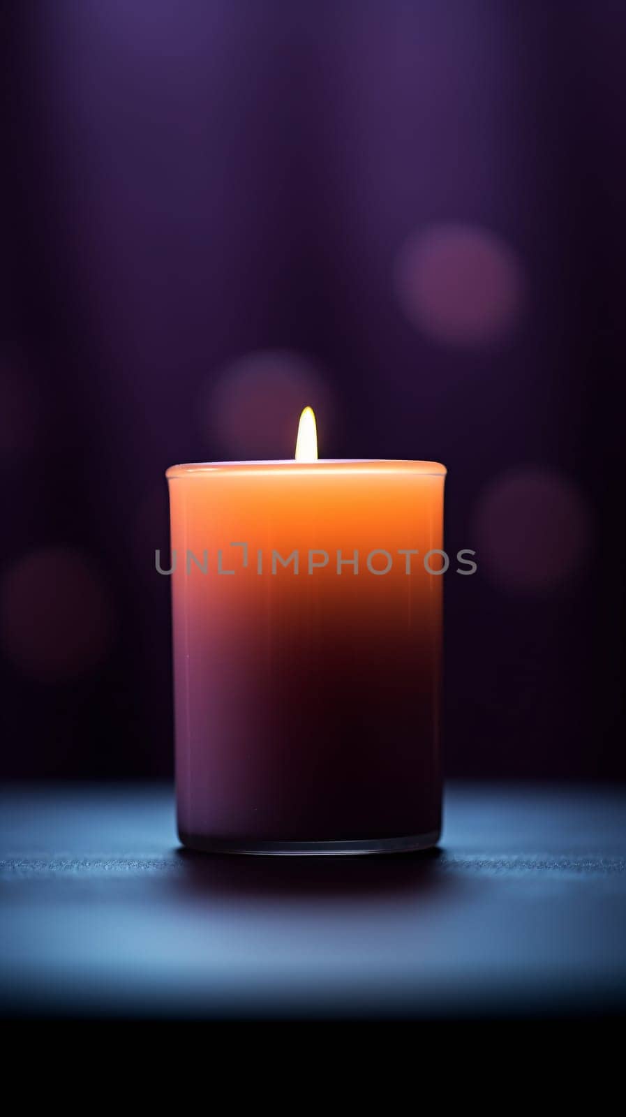 A lit candle with a flame against violet background with defocused lights by chrisroll