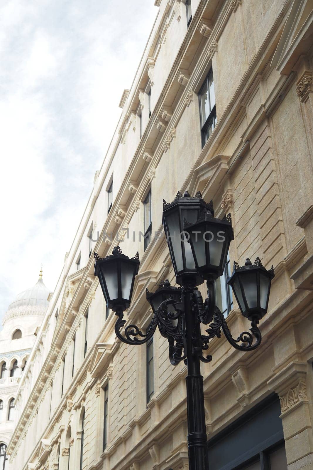 Elegant street lamp surrounded by buildings