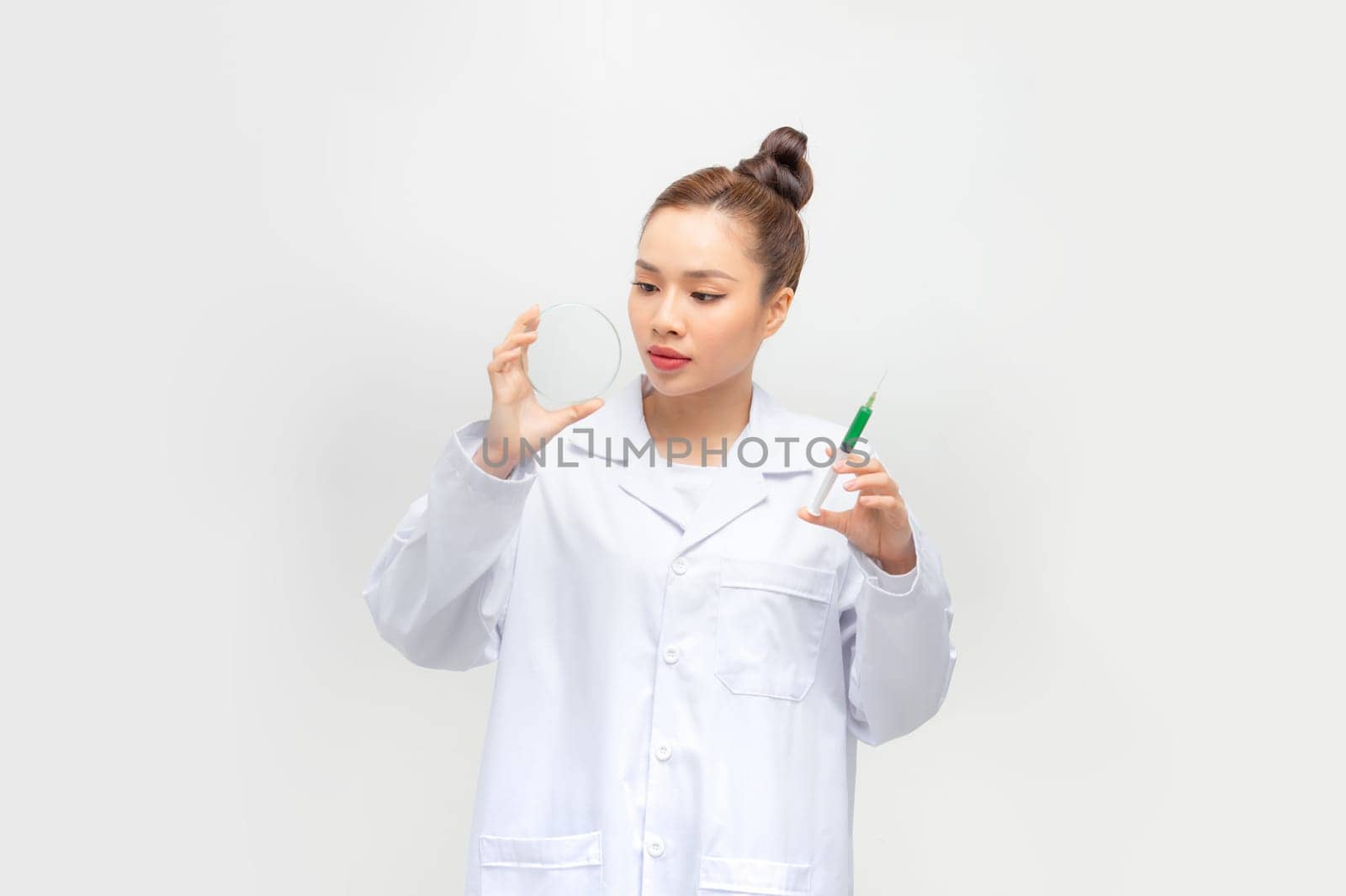 Scientific researcher analyzing dna substance in petri dish,  by makidotvn