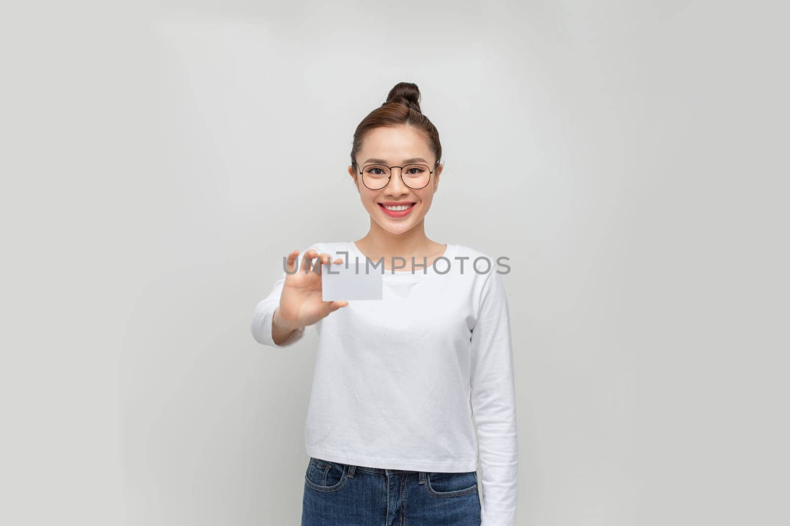 Woman showing business card on white background by makidotvn