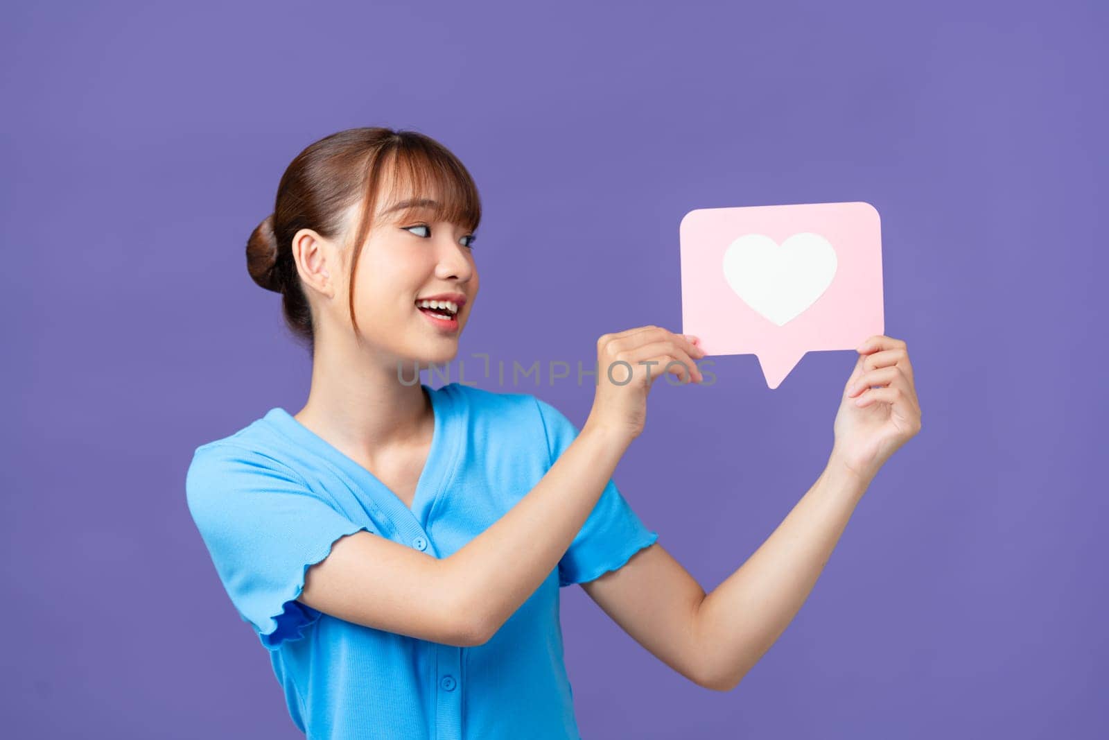 Cheerful lovely person toothy smile indicate finger hand hold paper like notification card by makidotvn