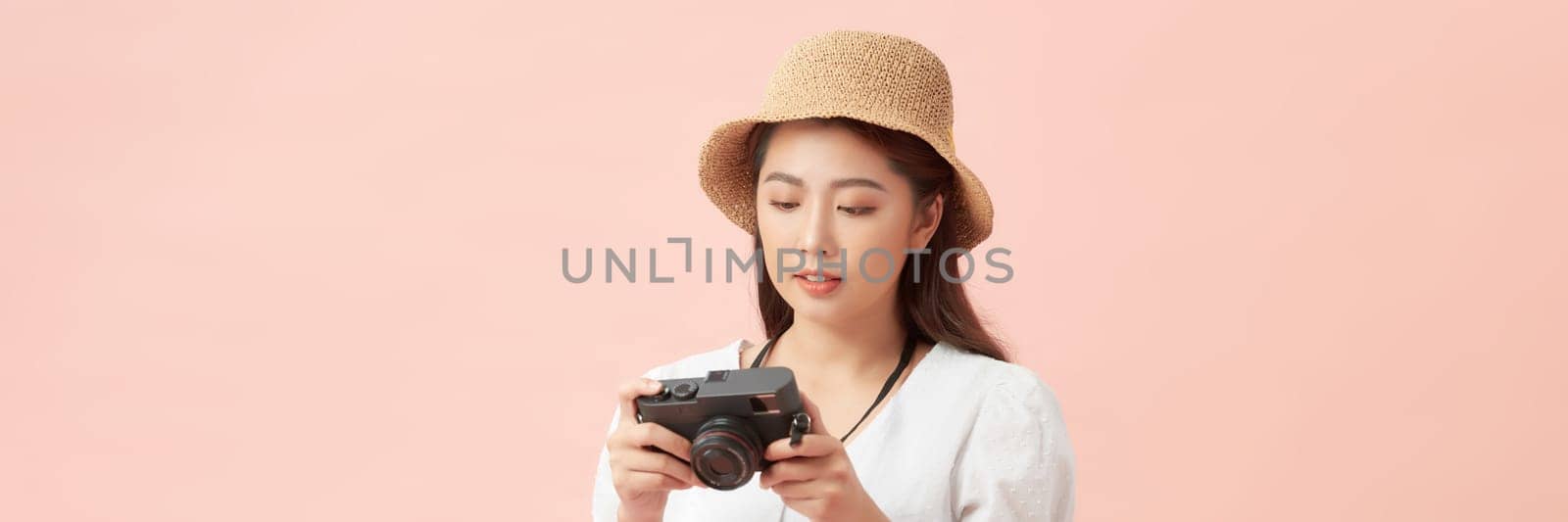 wide banner. asian woman hipster traveler with camera and hat in casual clothing happy and smiling  by makidotvn