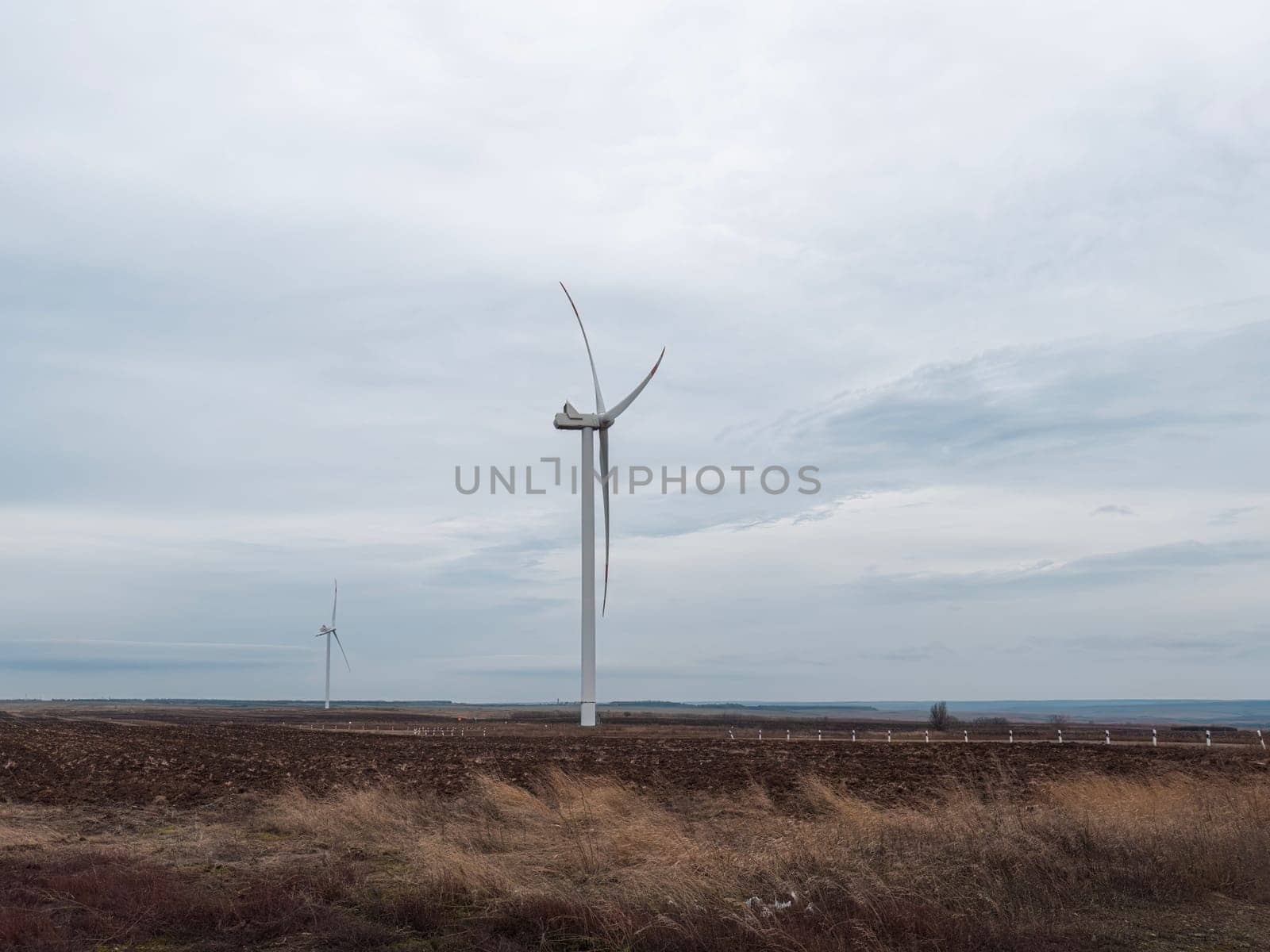 a wind turbine rotates in close-up on a beautiful background by roman112007