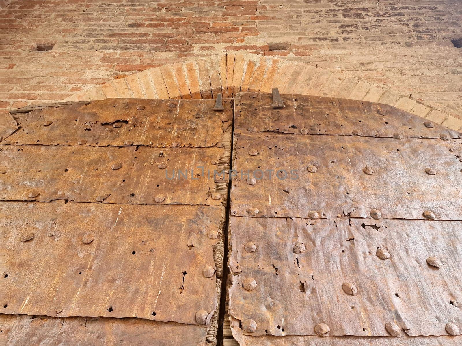 The wooden medieval door of noli medieval village liguria italy