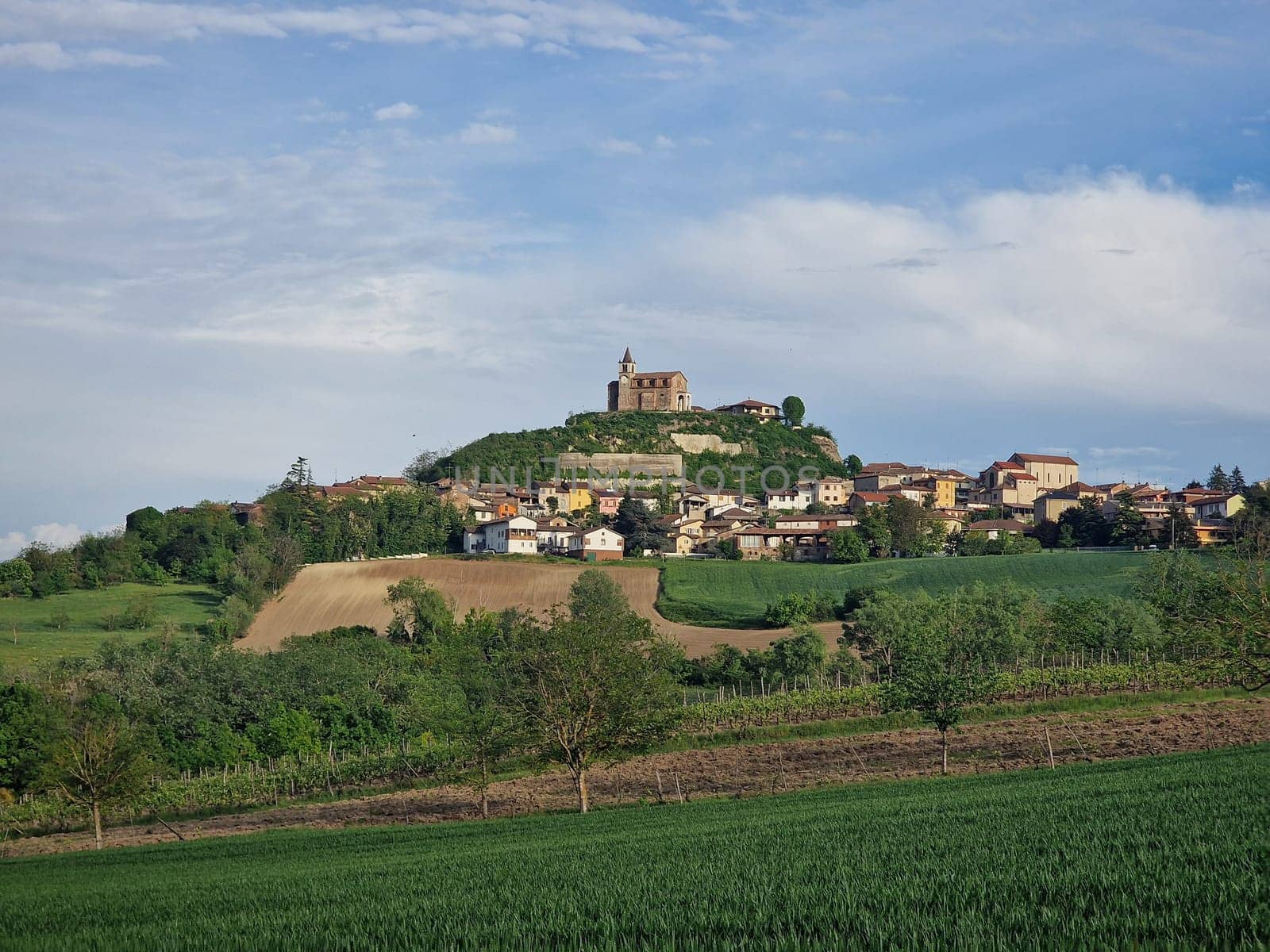 Sarezzano village on Landscape on the Tortona hills (Colli Tortonesi), in the Alessandria province, Piedmont, Italy, at springtime. by AndreaIzzotti