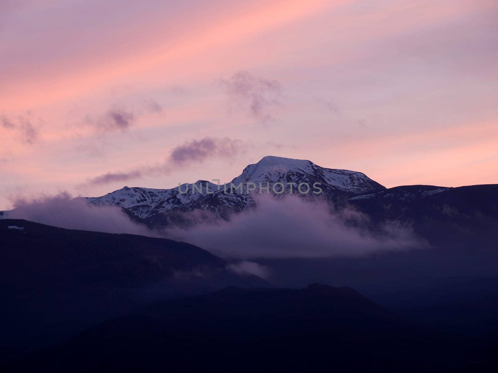 View of valley around Bismantova stone a rock formation in the Tuscan-Emilian Apennines (Italy) at sunset by AndreaIzzotti