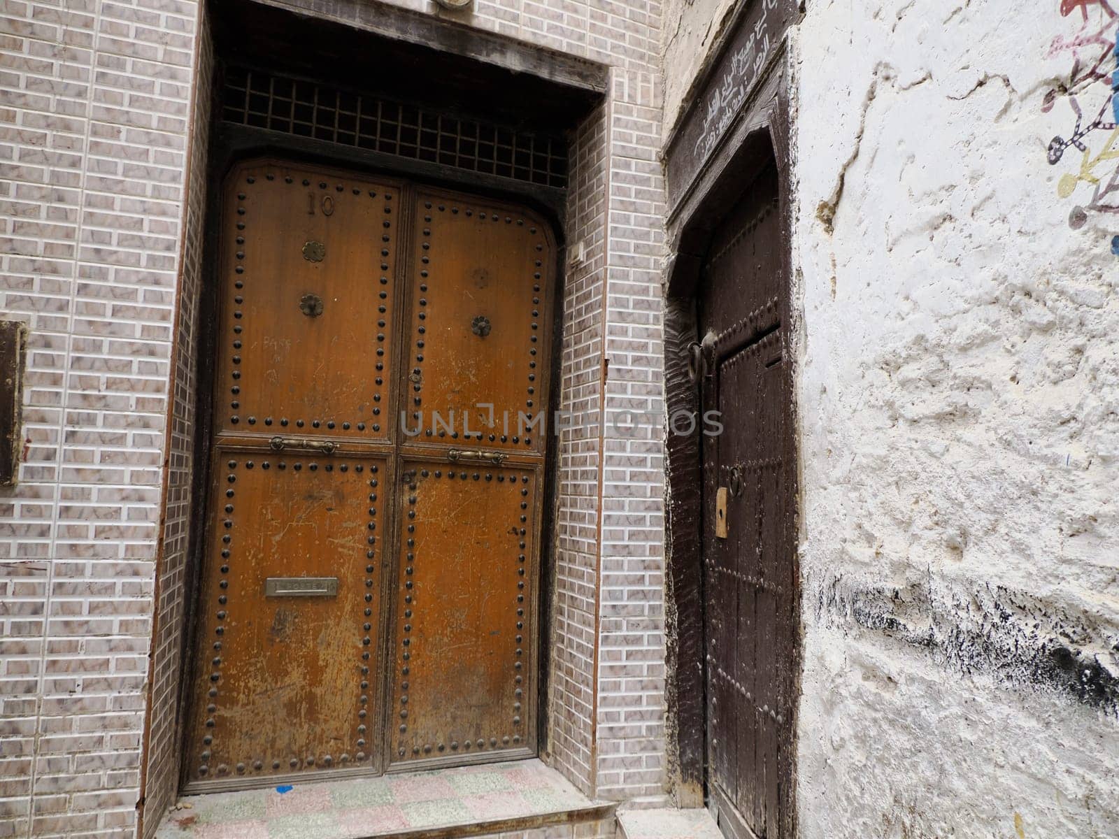 old wooden doot in Fez Fes Blue and white medina (old town). Morocco.