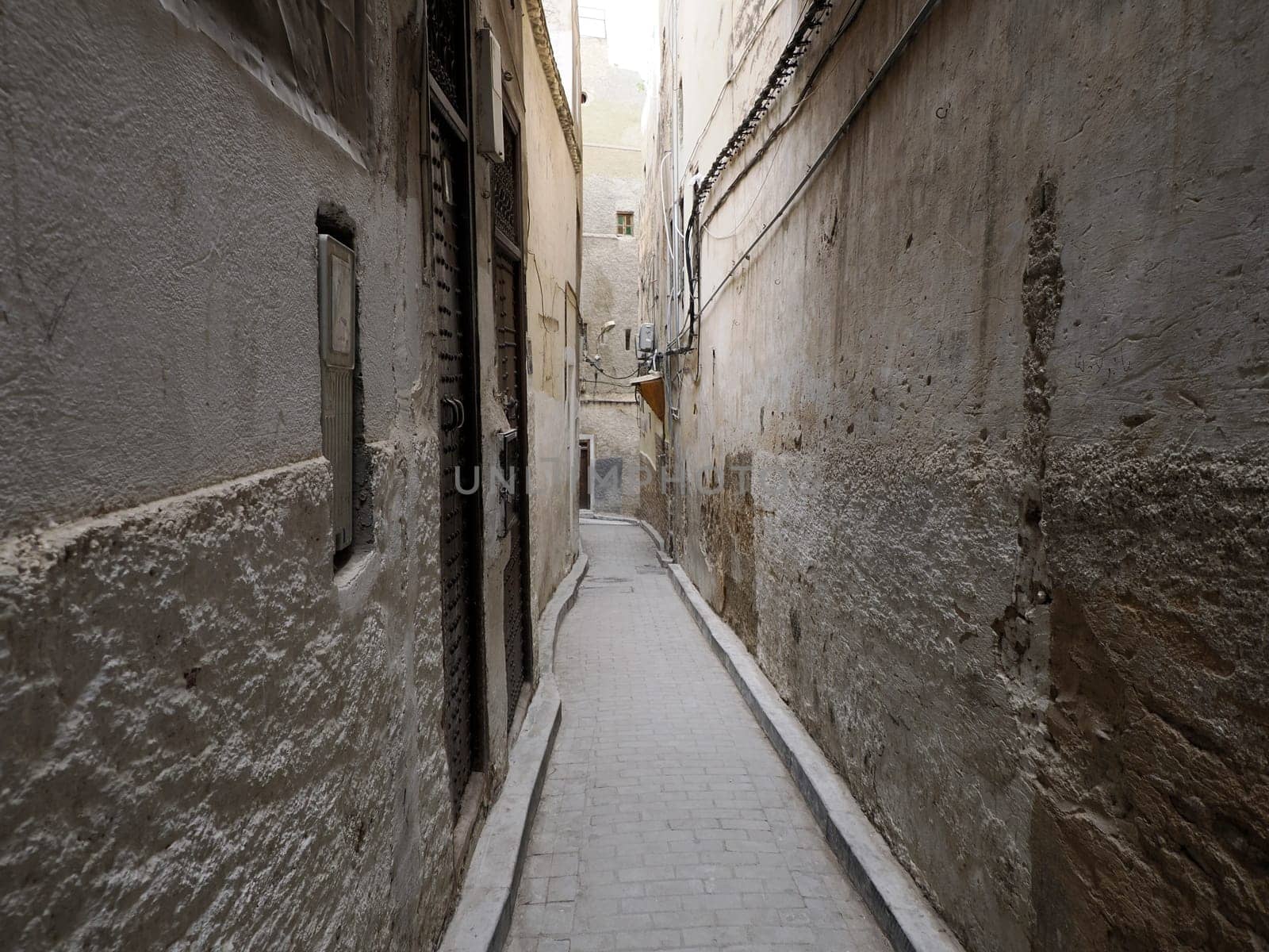 A Small street in Fez Fes medieval medina (old town). Morocco.