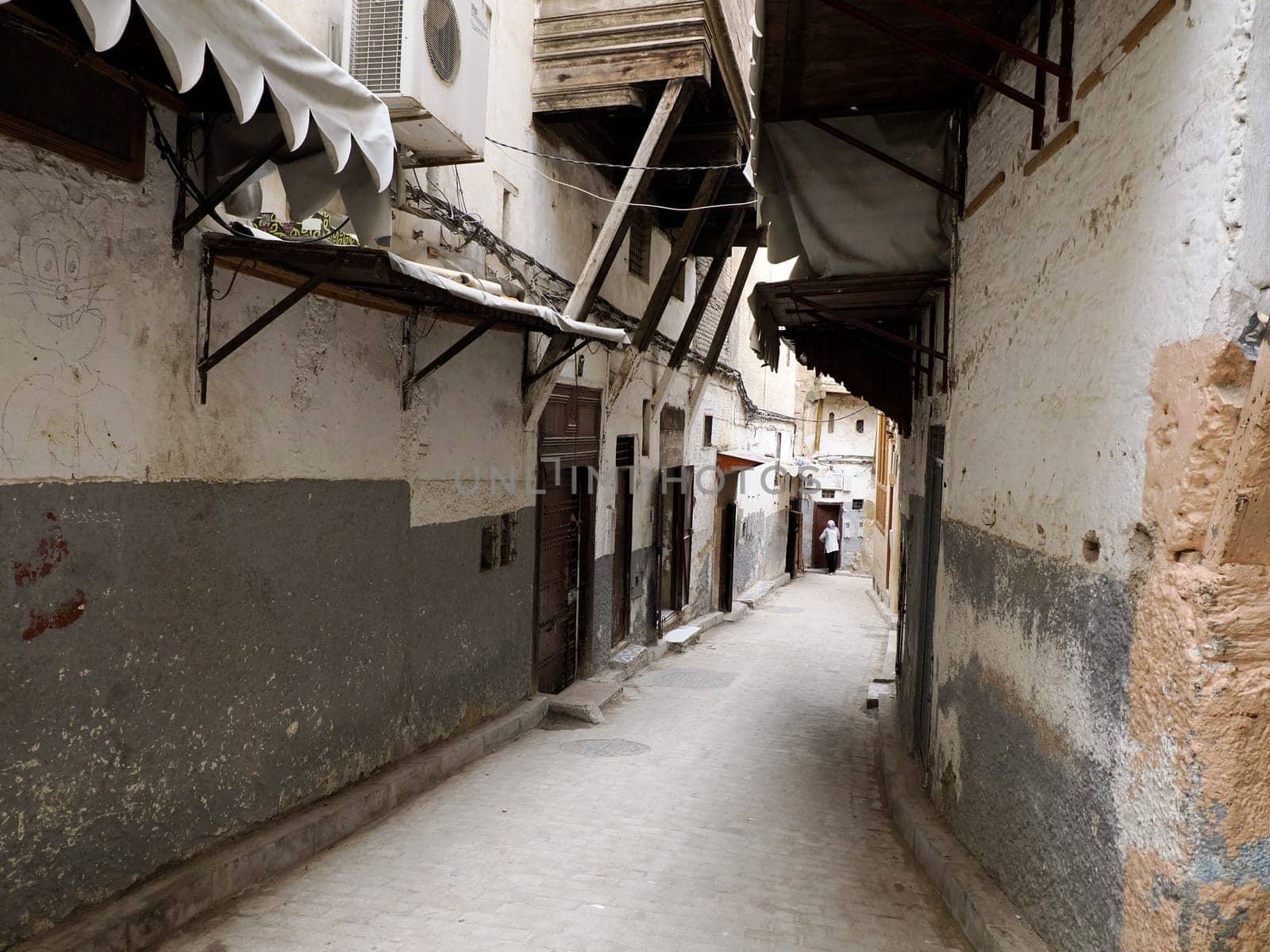 A Small street in Fez Fes medieval medina (old town). Morocco.