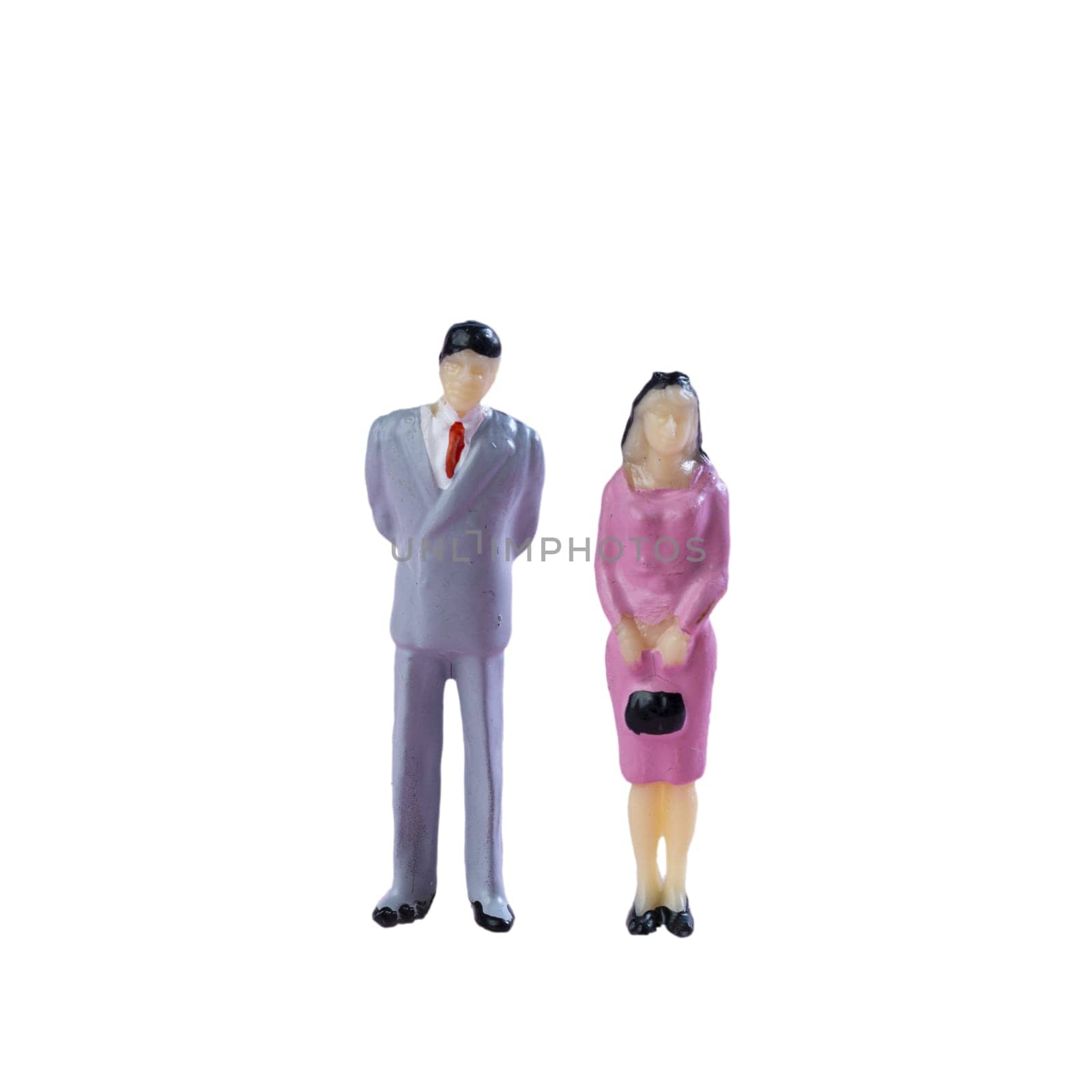 a couple of miniature people together on a transparent background