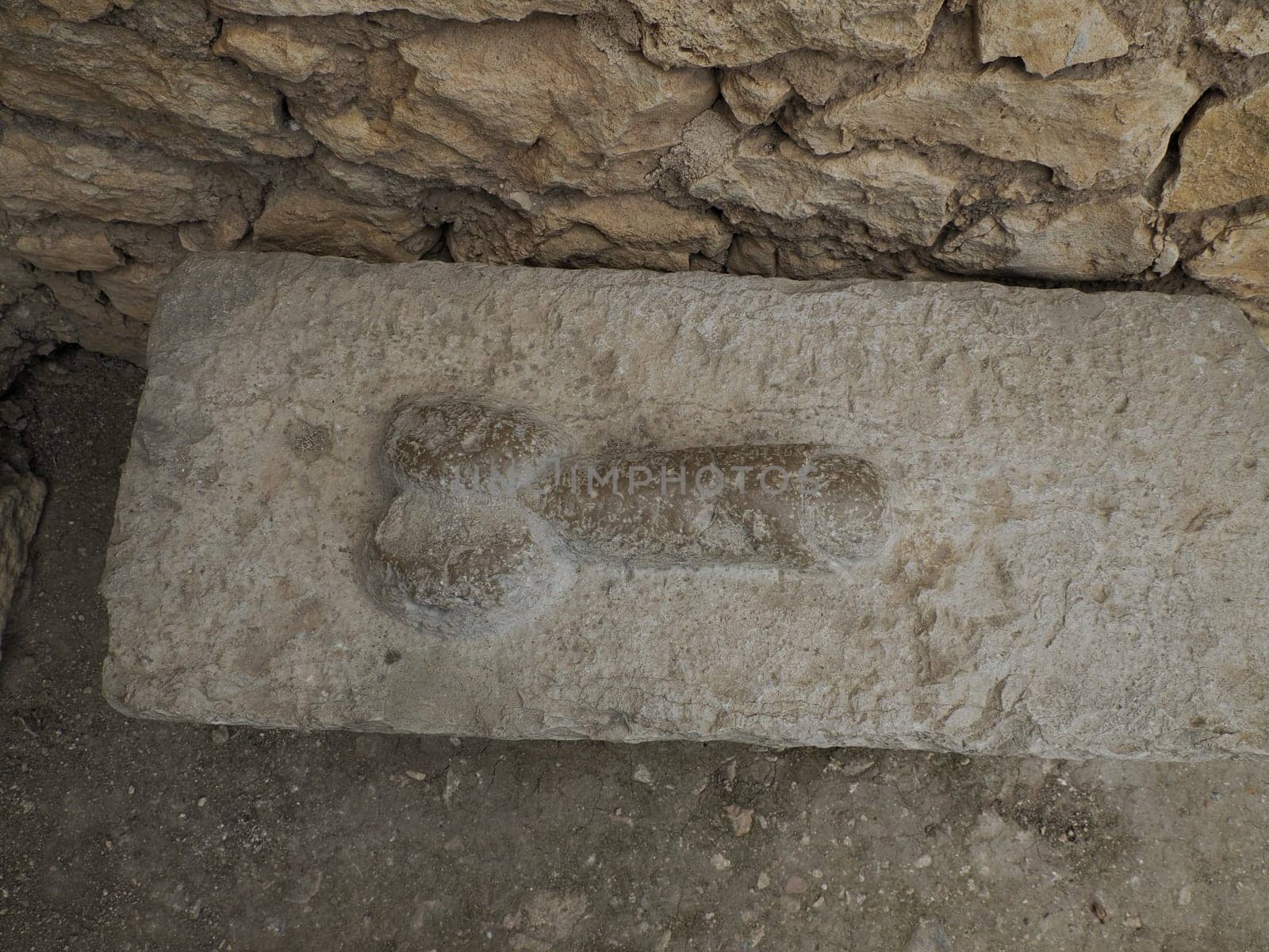 brothel penis sign at Volubilis Roman ruins in Morocco- Best-preserved Roman ruins located between the Imperial Cities of Fez and Meknes on a fertile plain