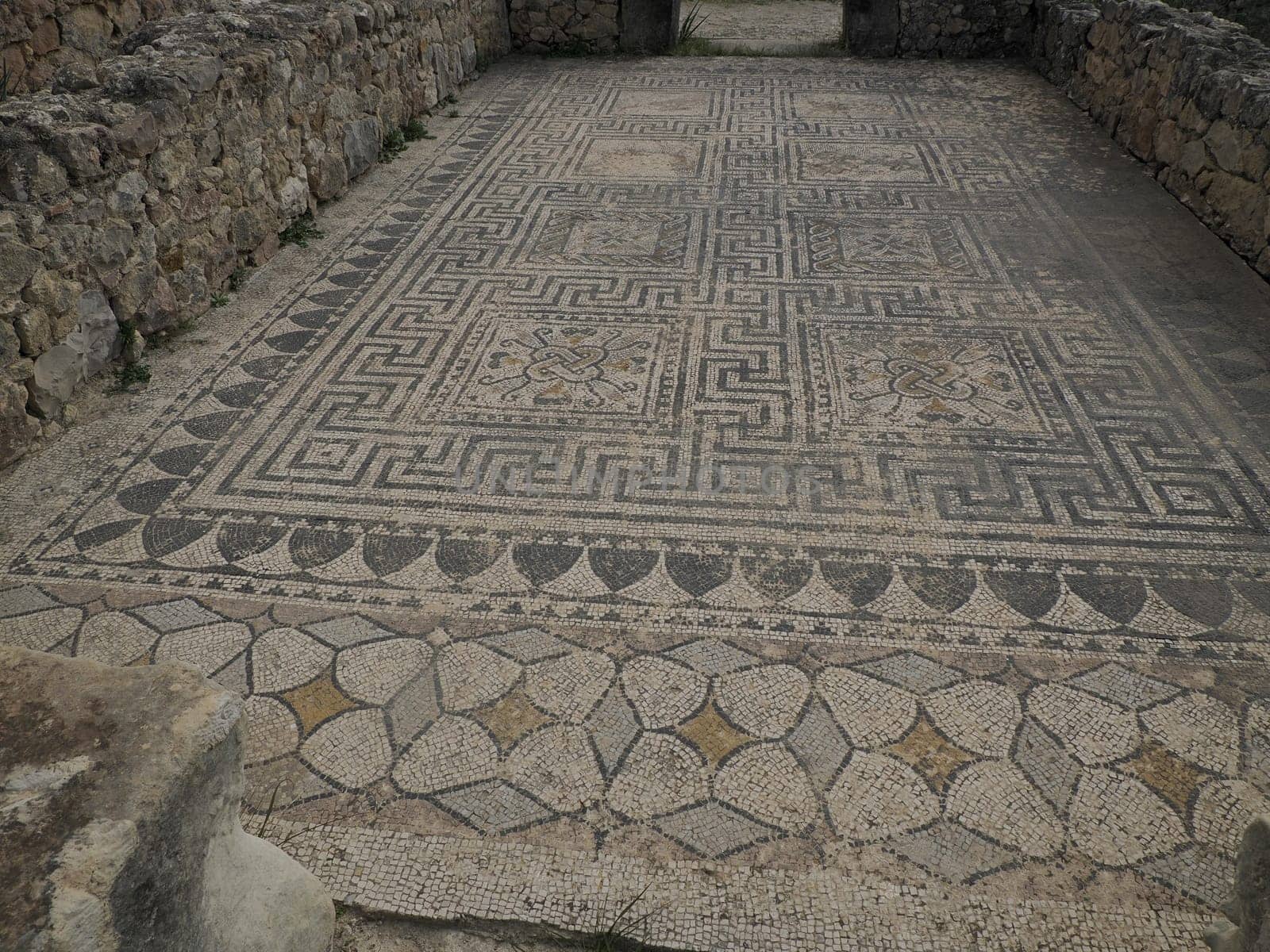 mosaic in Volubilis Roman ruins in Morocco- Best-preserved Roman ruins located between the Imperial Cities of Fez and Meknes by AndreaIzzotti