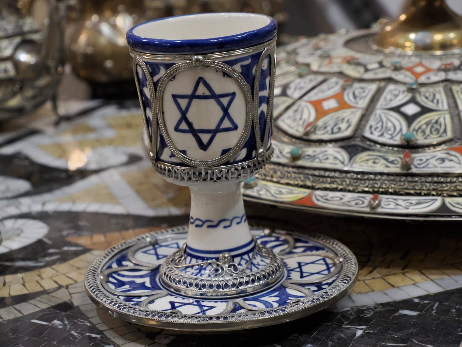 jewish Craftsman painting and decorating ceramic products in pottery factory in Fez, Morocco, North Africa