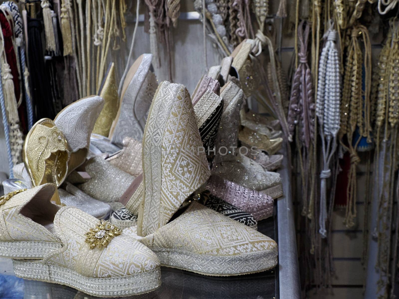 bride festive shoes Colorful handmade leather slippers waiting for clients at shop in Fes, next to tanneries, Morocco by AndreaIzzotti