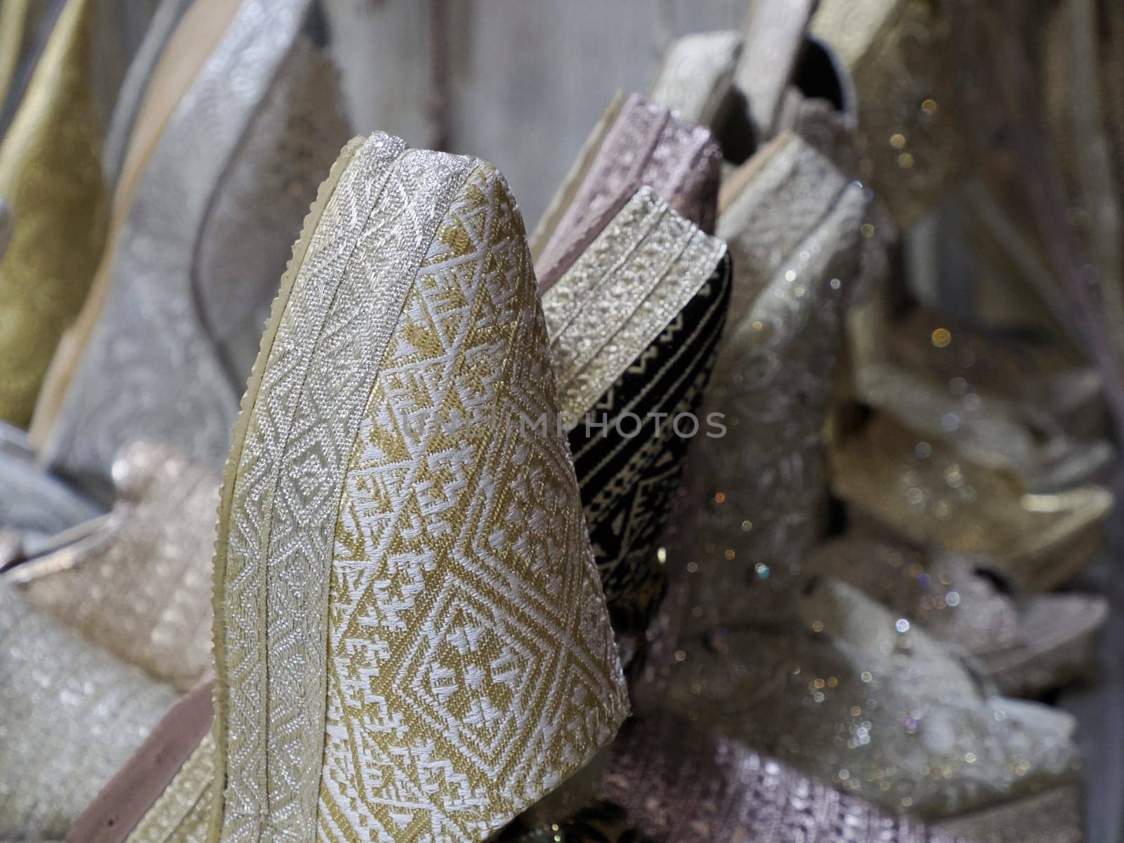 bride festive shoes Colorful handmade leather slippers waiting for clients at shop in Fes, next to tanneries, Morocco by AndreaIzzotti