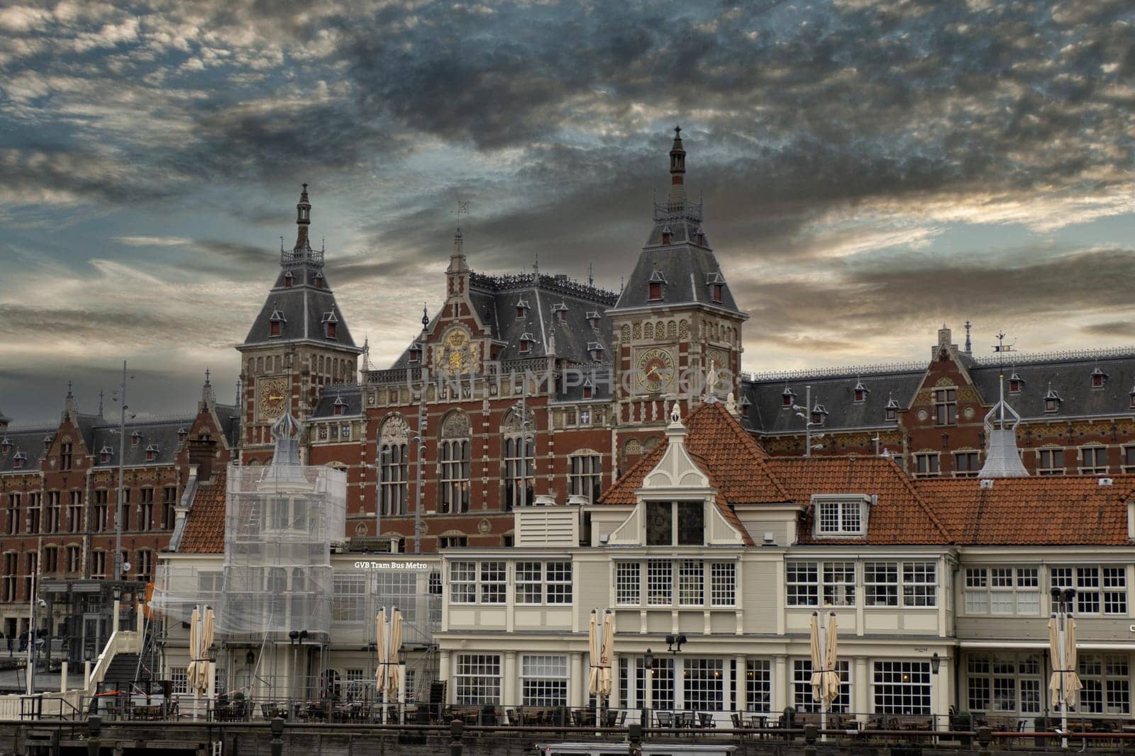 Central station in amsterdam old houses view from canals by AndreaIzzotti