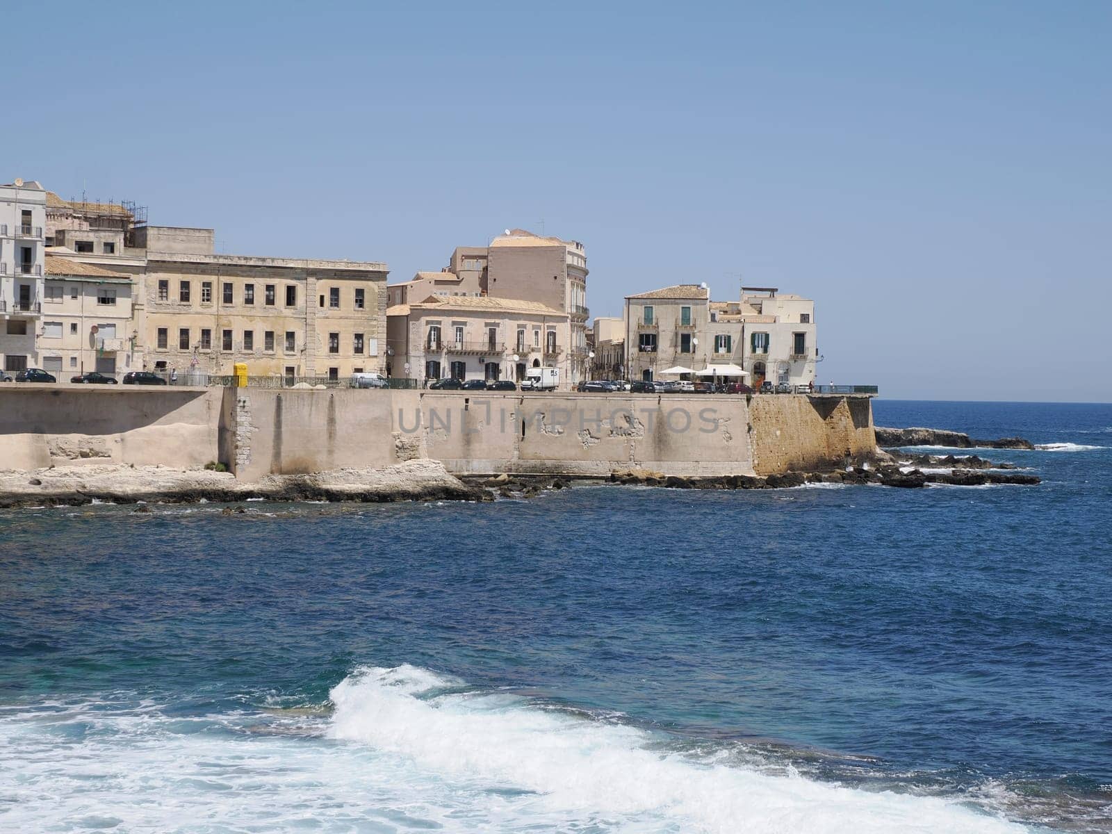 sea on ortigia syracuse old buildings street view on sunny day Sicily, Italy