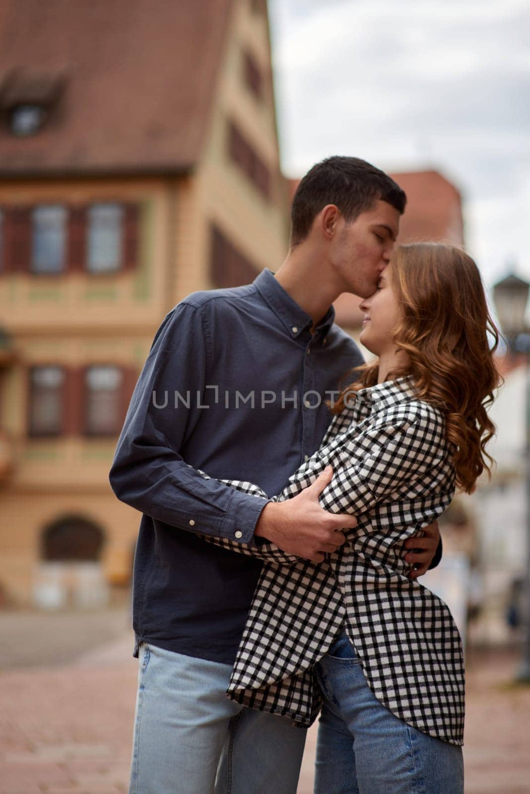 Young Cute Female Hugs Boyfriend. In Autumn Outdoor. Lovers Walking in Park. Attractive Funny Couple. Lovestory in Forest. Man and Woman. Cute Lovers in the Park. Family Concept. Happy Couple.