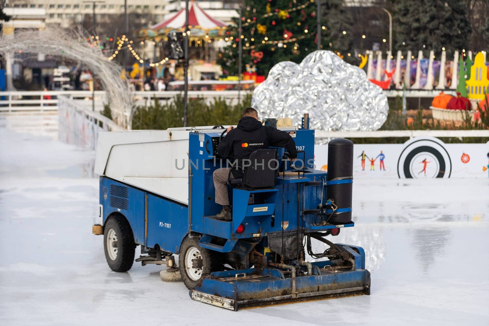 special machine ice harvester cleans the ice rink. transport industry by Andelov13