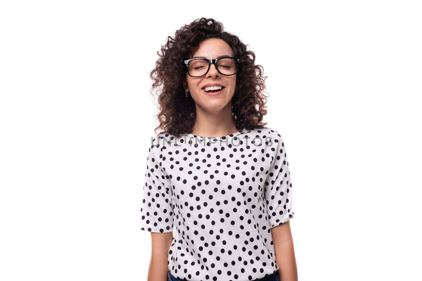 young caucasian woman with curly hair styling dressed in a summer blouse with short sleeves by TRMK