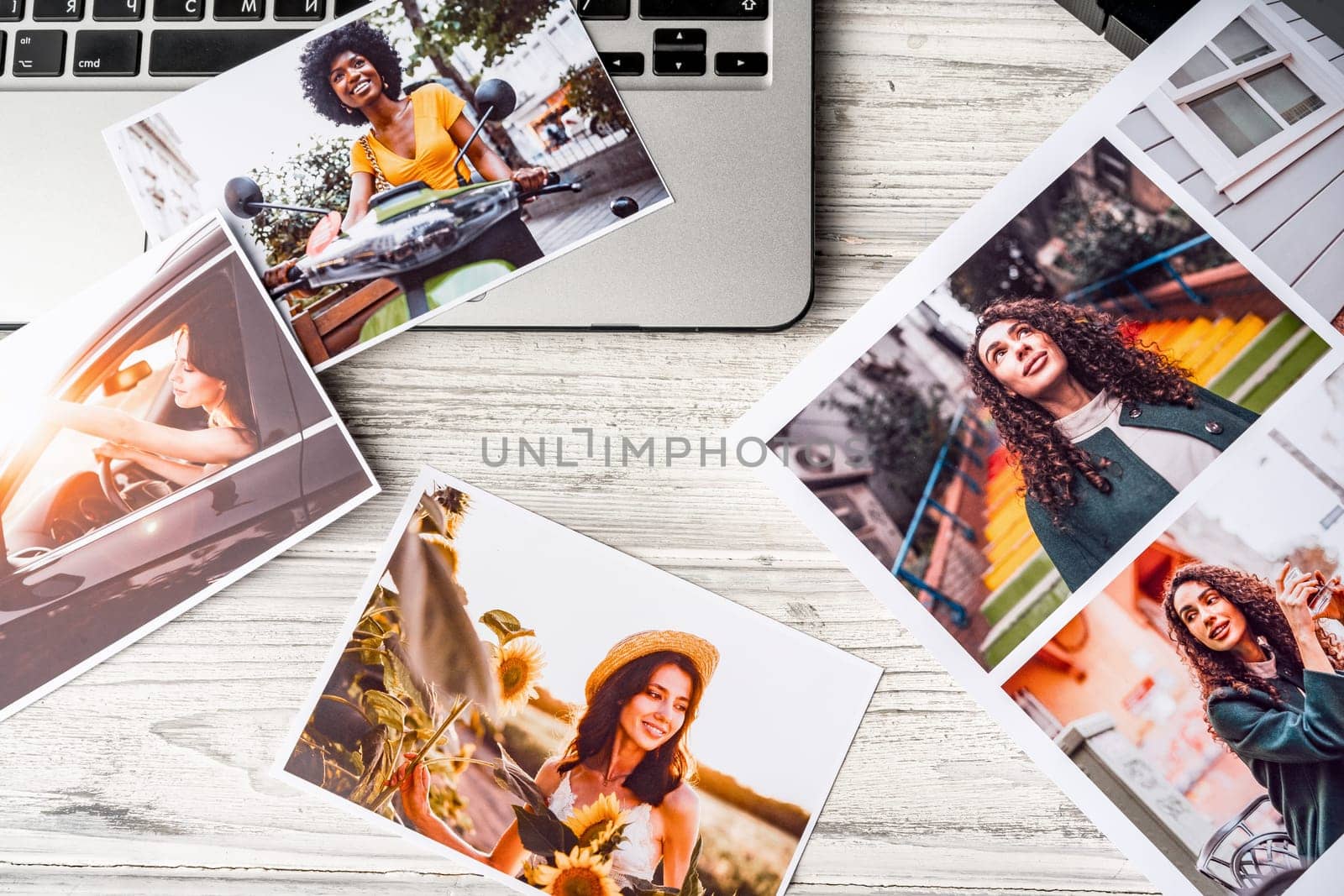 Printed colorful photos of women portraits. Printing photos hobby concept