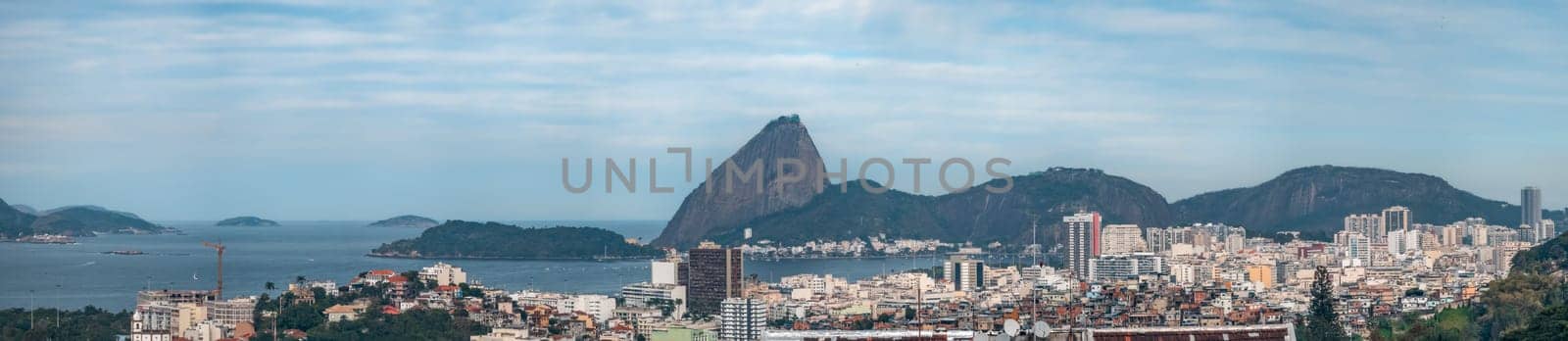 Vibrant Brazilian cityscape merging urban living with natural hills and ocean scenery.