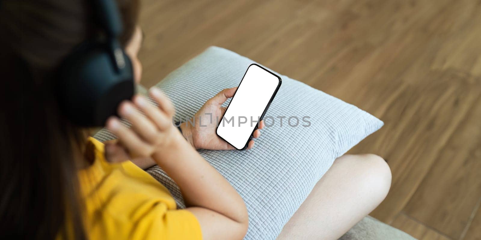 Closed up with Asian woman feels relax using smartphone in living room, Blank screen of smartphone.