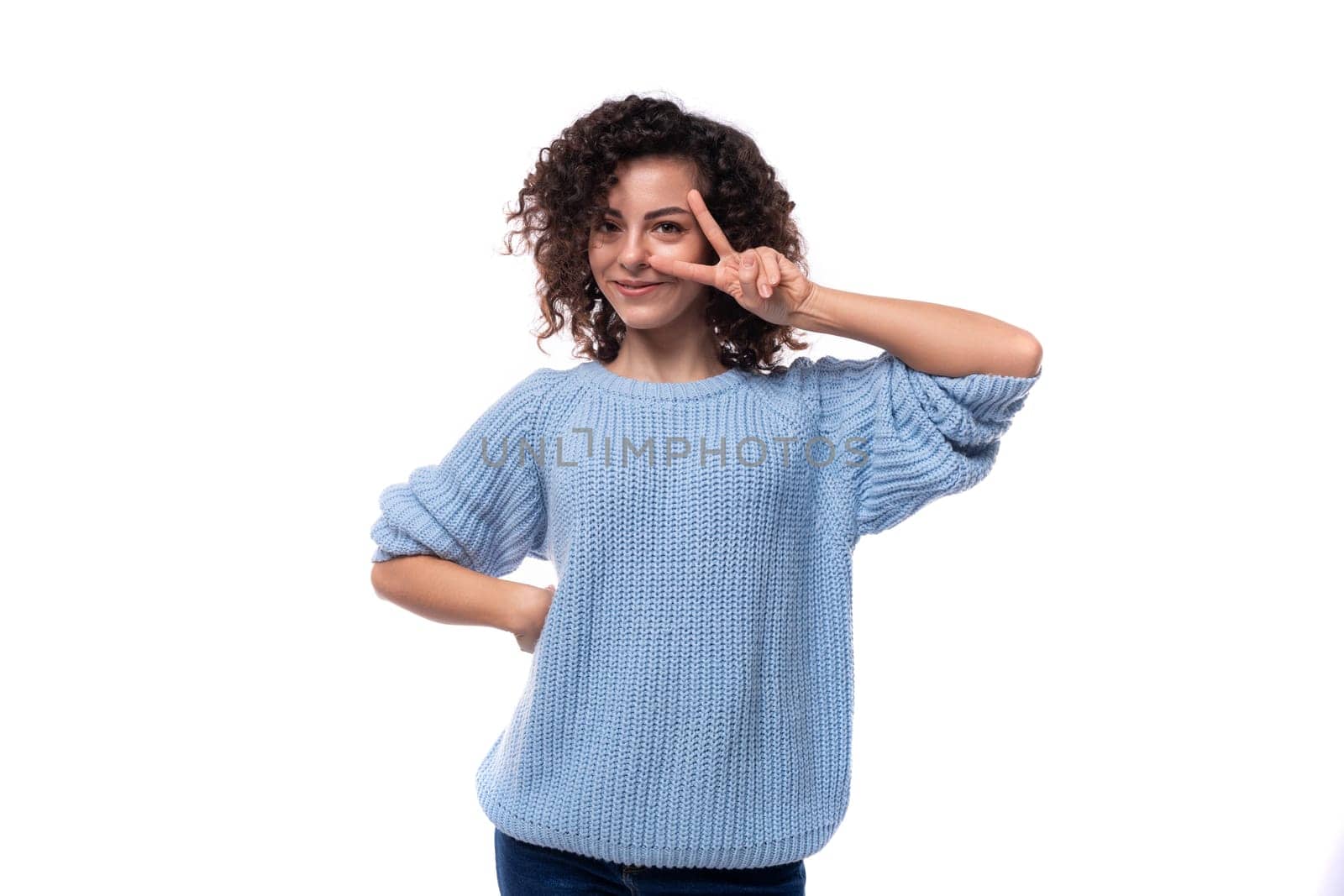 young authentic brunette woman with curly hairstyle on white background with copy space.